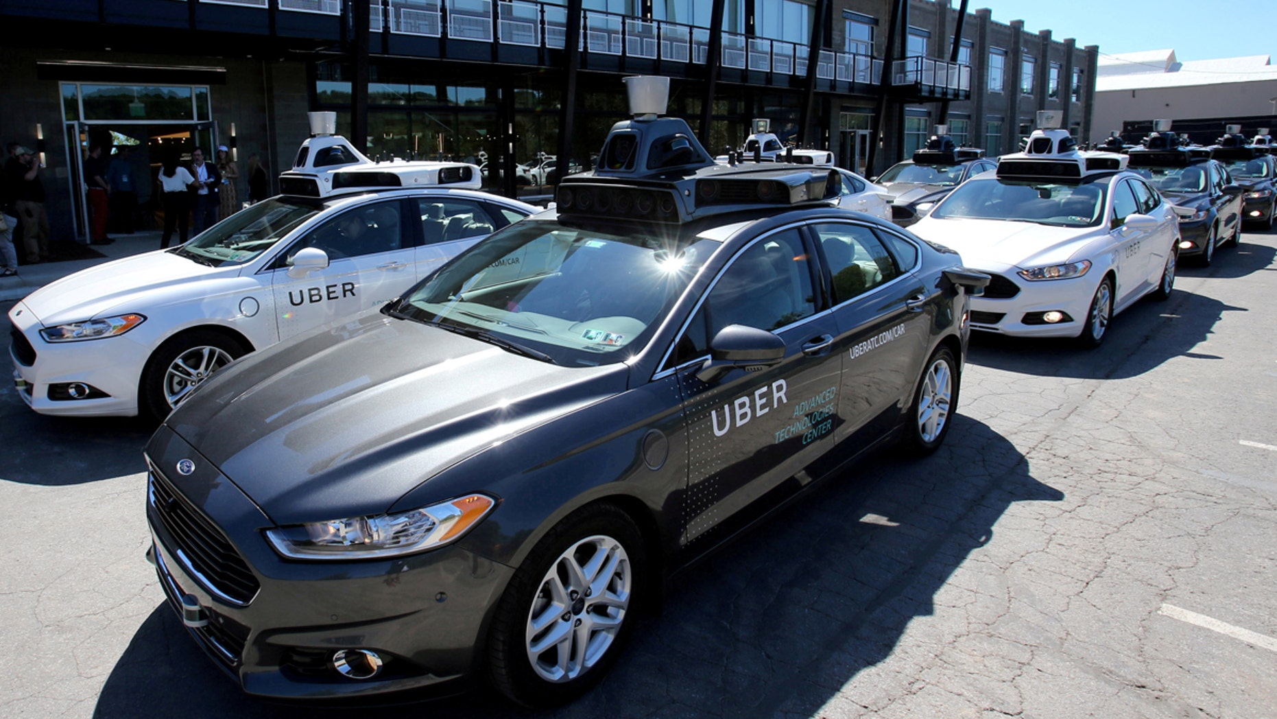 A fleet of Uber's Ford Fusion self-driving cars are shown in Pittsburgh, Pennsylvania.