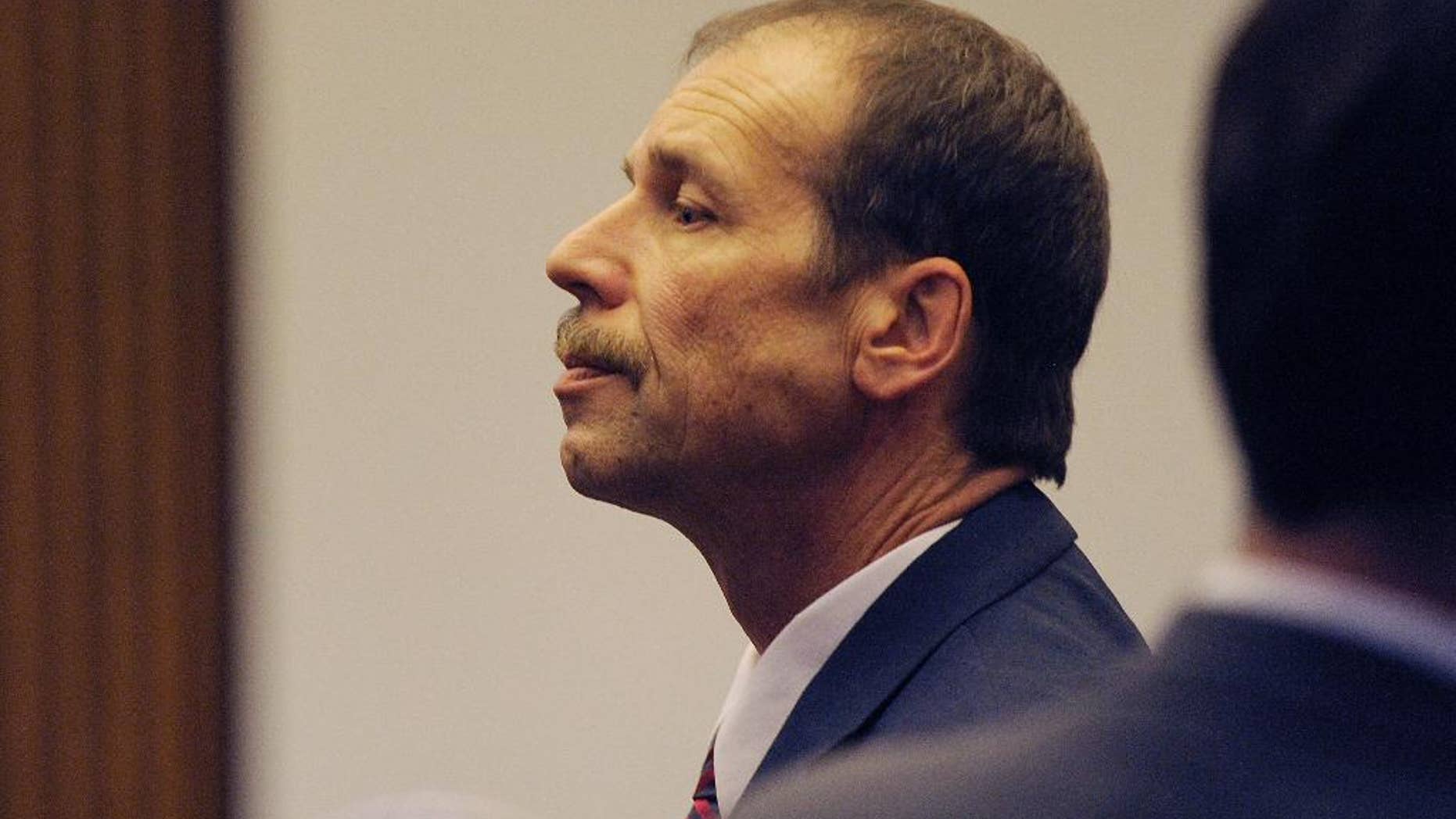Theodore Wafer pauses at the end of Day 3 of his trial, Monday, July 28, 2014, Detroit, Mich. Wafer is the Dearborn Heights homeowner charged in the shooting death of Renisha McBride. (AP Photo/The Detroit News, Clarence Tabb Jr.)