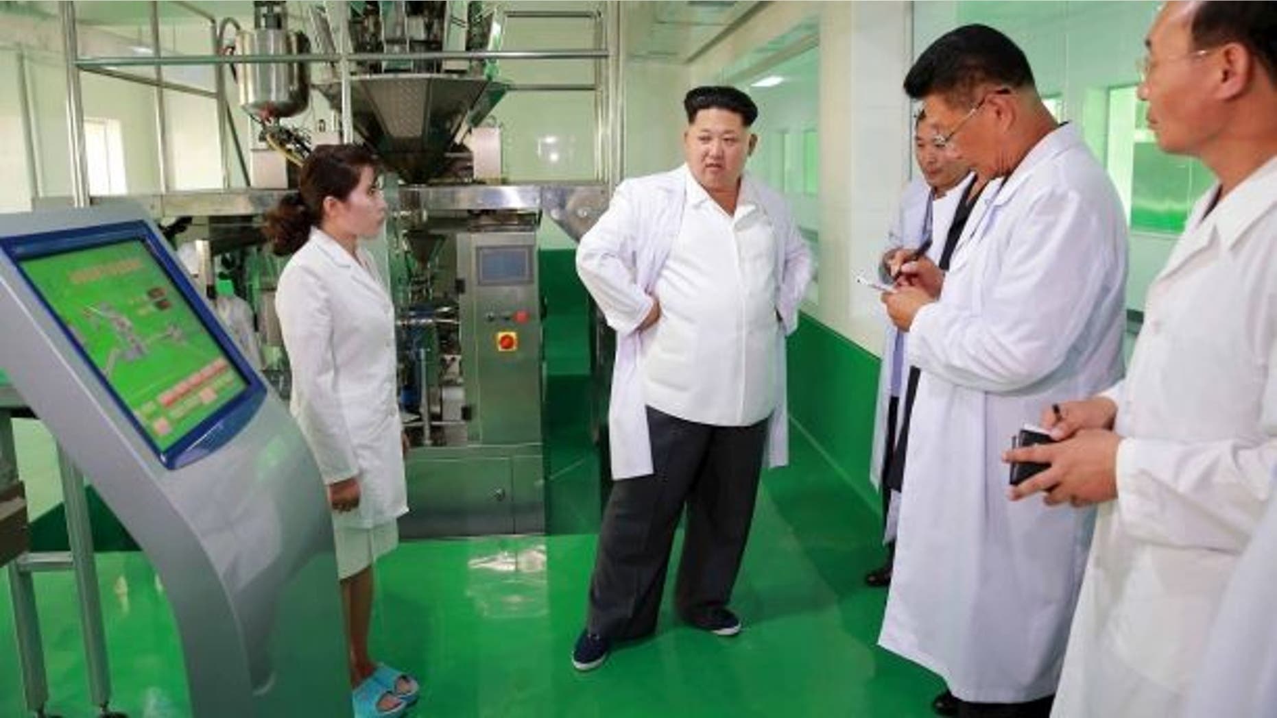 North Korean leader Kim Jong Un provides field guidance to the newly built Pyongyang Corn Processing Factory