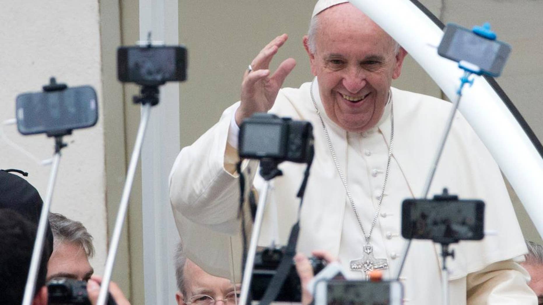 Pope Francis arrives for his weekly general audience in St. Peter's Square at the Vatican, Wednesday, Oct. 28, 2015. (AP Photo/Alessandra Tarantino)