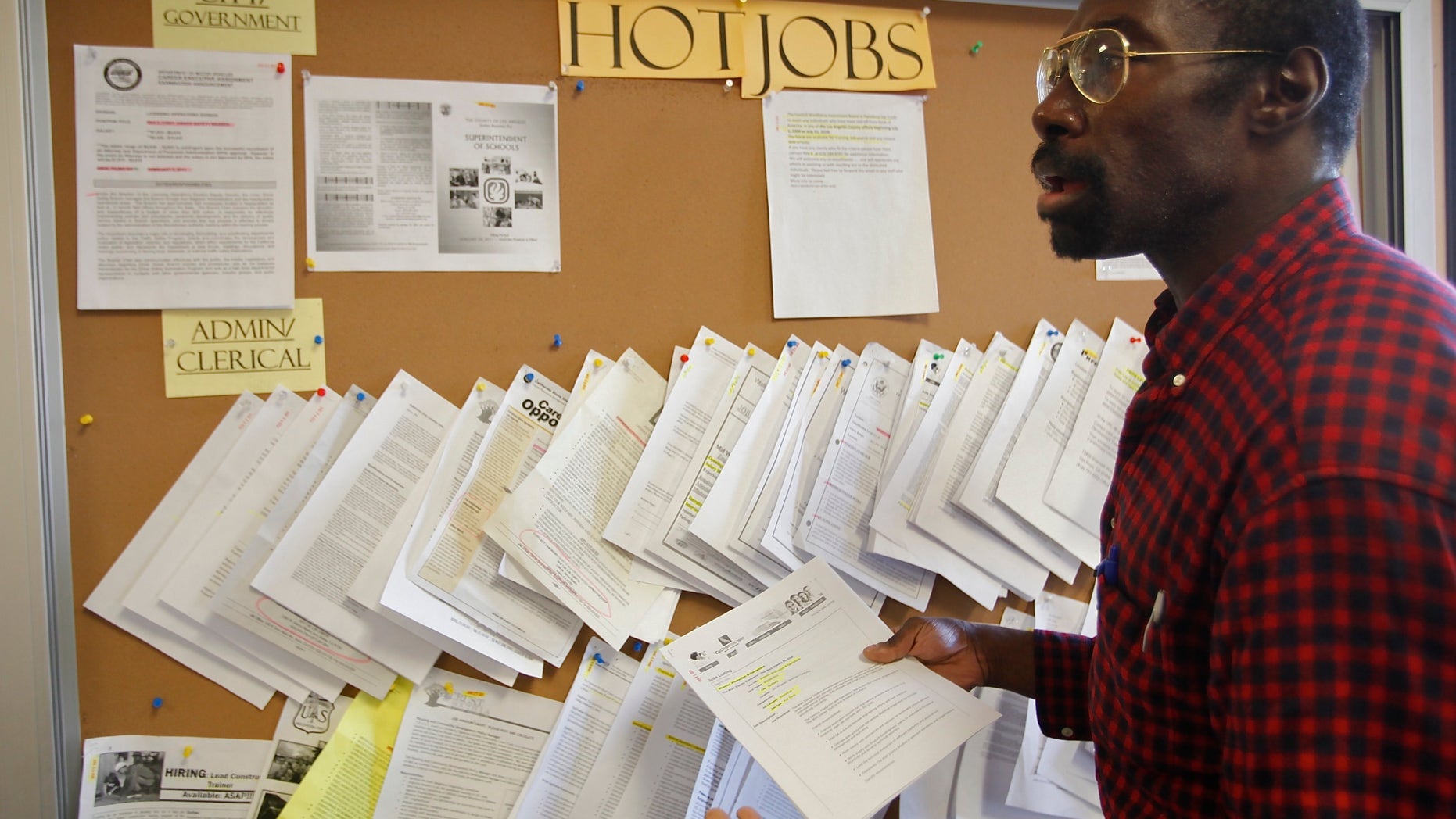 February 2011: Job seeker Richard Phillips looks for a job opportunity at the Verdugo Job Center in Glendale, California.