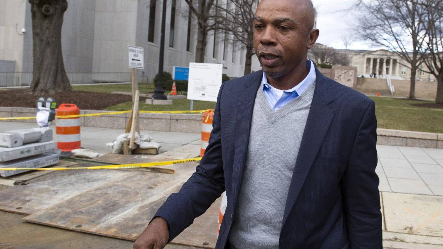 FILE - In this Feb. 2, 2015 file photo, basketball analyst Greg Anthony leaves the D.C. Superior Court in Washington. Anthony will have a soliciting prostitution charge dropped if he does 32 hours of community service and stays out of trouble for four months. Anthony, his attorney and a prosecutor told a judge Wednesday that they had agreed to the deal, called a deferred prosecution agreement. (AP Photo/Cliff Owen, File)