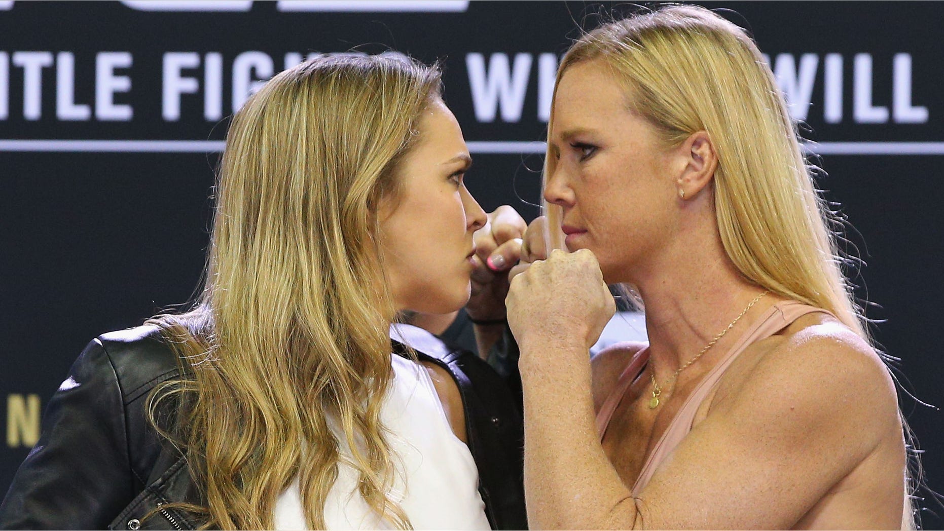 MELBOURNE, AUSTRALIA - SEPTEMBER 16: UFC Women's Bantamweight Champion Ronda Rousey (L) faces off against Holly Holm during the UFC 193 media event at Etihad Stadium on September 16, 2015 in Melbourne, Australia. (Photo by Michael Dodge/Zuffa LLC/Zuffa LLC via Getty Images)