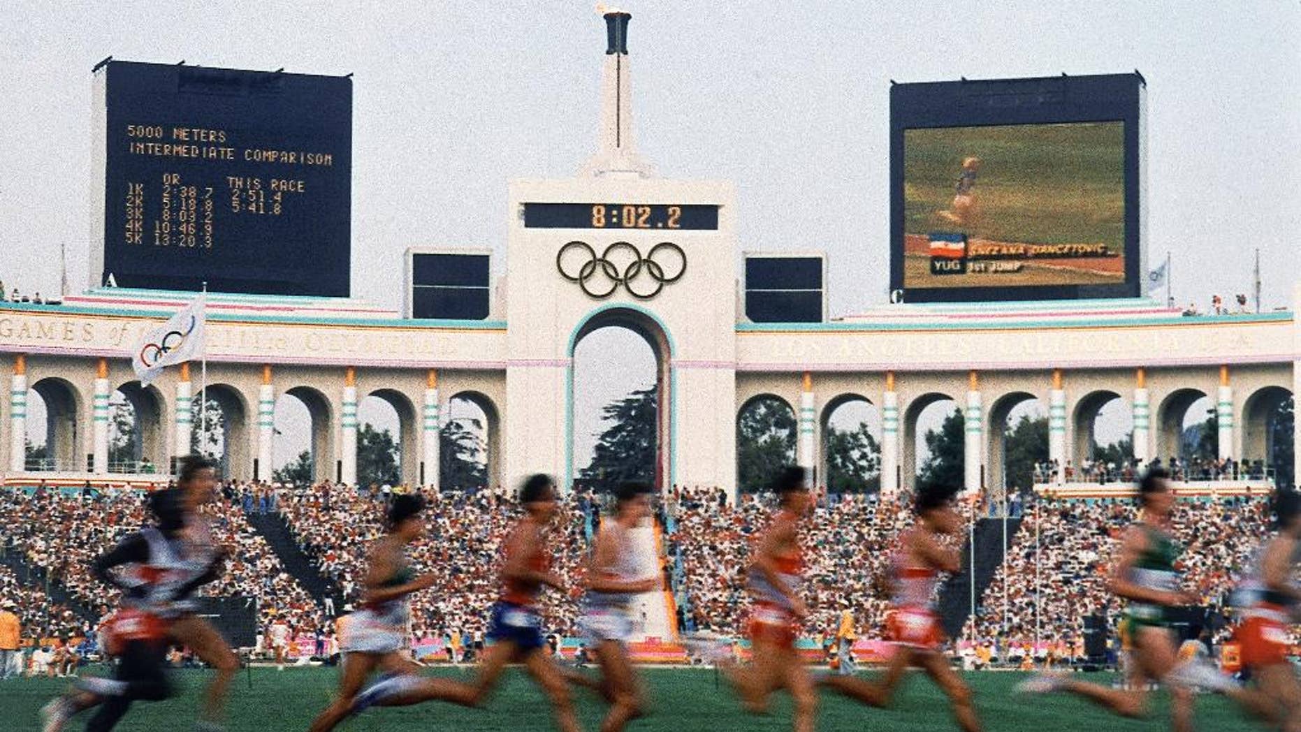 FILE - This Aug. 11, 1984, file photo shows a field of entrants during the Men's 5,000 meter event at the Summer Olympic Games in Los Angeles. Glamour, celebrities, perfect weather. A revitalized and growing downtown. Iconic venues and political support. With these virtues, Los Angeles looks like an ideal fit to host the 2024 Olympics. (AP Photo, File)
