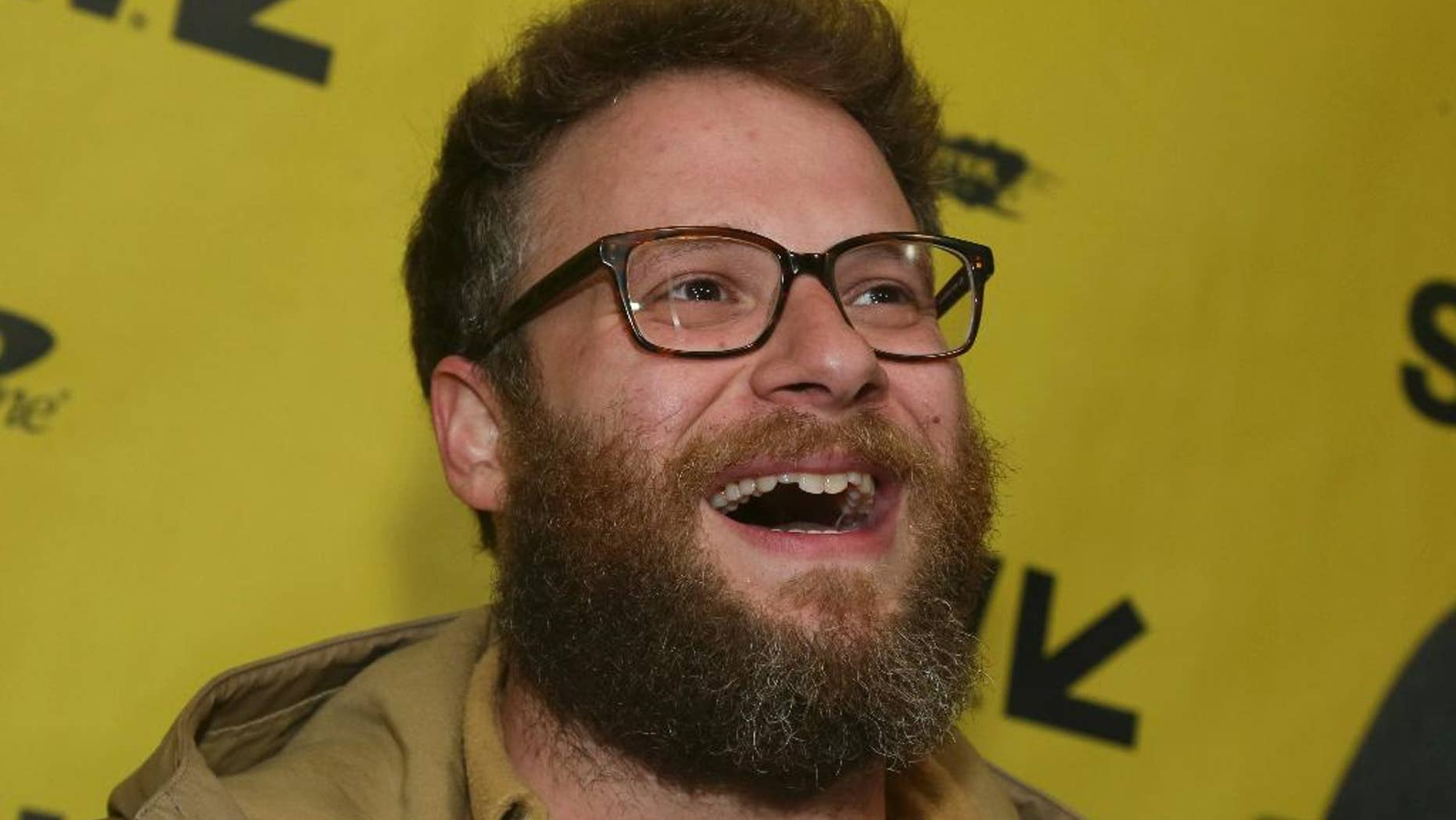 FILE - In this March 12, 2017, file photo, Seth Rogen arrives for "The Disaster Artist" at the Paramount Theatre during the South by Southwest Film Festival in Austin, Texas. Rogen became an honorary member of the Pi Kappa Alpha fraternity chapter at the University of Vermont on April 17, 2017. (Photo by Jack Plunkett/Invision/AP, File)