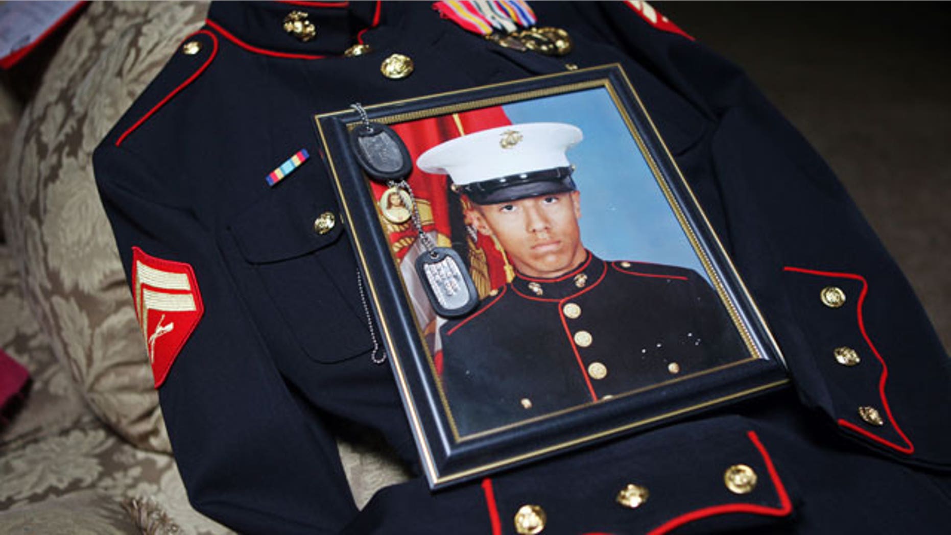 Jan. 15, 2012: Itzcoatl Ocampo's dress uniform, government military photo, dog tags and a religious medallion that went to war with him lie on display at Ocampo's home in Yorba Linda, Calif.