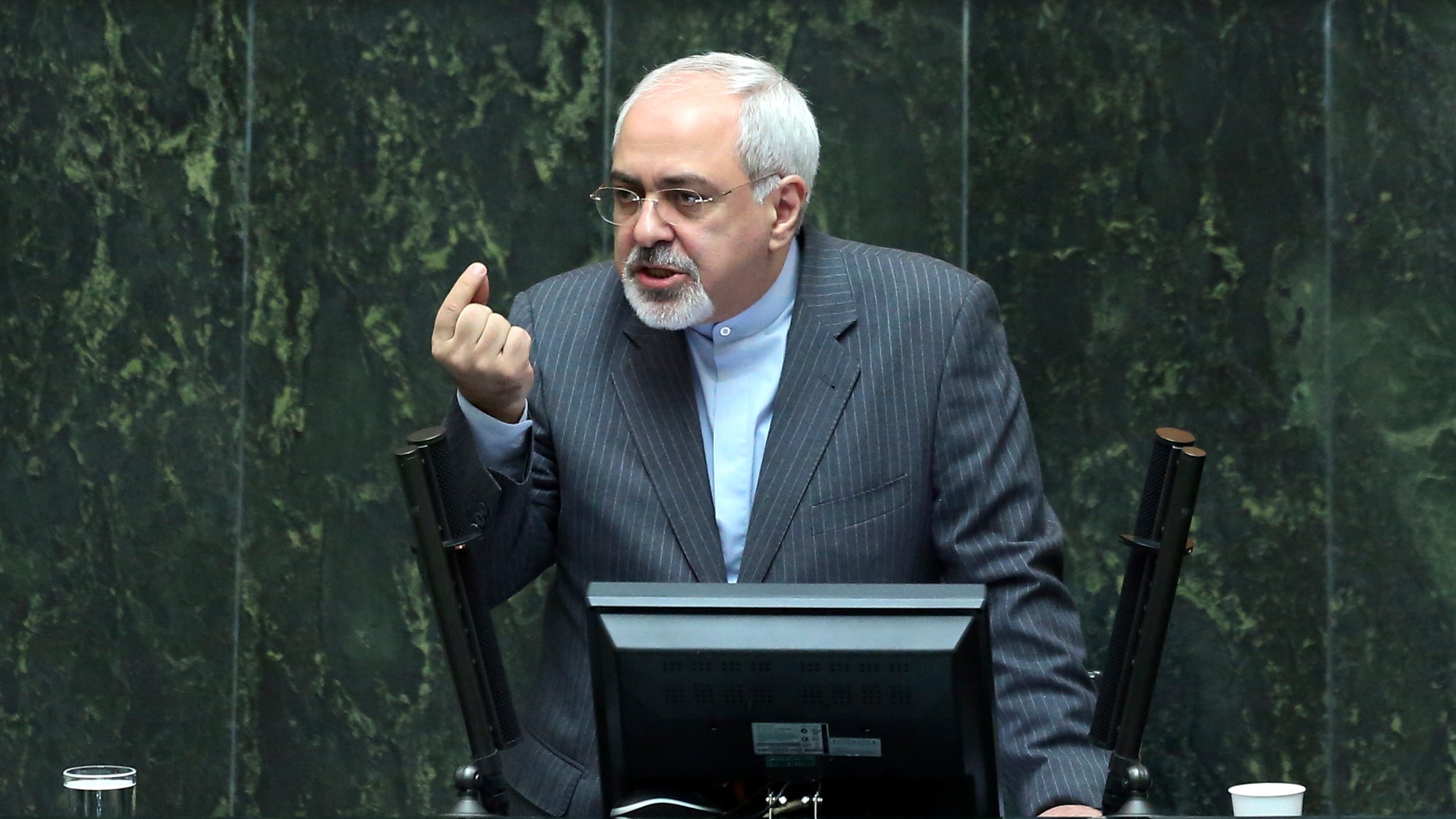 Iranian Foreign Minister Mohammad Javad Zarif speaks in the parliament in Tehran, Iran, Wednesday, Nov. 27, 2013. Hard-line Iranian politicians publicly criticized the deal reached in Geneva last week over the Islamic Republic's nuclear program, an agreement that has largely been welcomed by Iranians. (AP Photo/Ebrahim Noroozi)