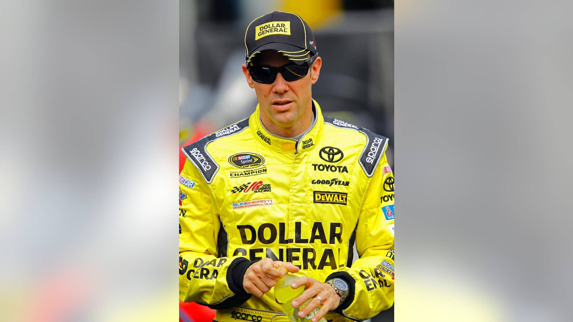 Matt Kenseth walks through the pit area during practice for a NASCAR Sprint Cup Series auto race at Bristol Motor Speedway on Friday, April 17, 2015, in Bristol, Tenn. Kenseth will start on the pole Sunday. (AP Photo/Wade Payne)
