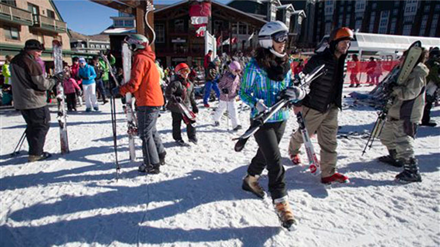 Skiers make their way to the slopes at Park City Mountain Resort in Park City, Utah, Saturday, Jan. 14, 2012.