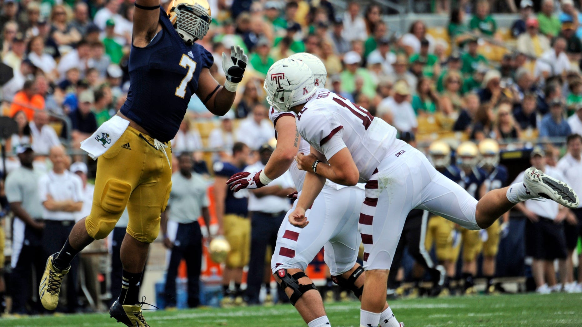 In this Aug. 31, 2013 photo, Notre Dame defensive lineman Stephon Tuitt (7) pressures Temple quarterback Connor Reilly, right, during a college football game in South Bend, Ind. Tuitt feels as comfortable playing the option as getting after quarterbacks, which is why he will be in the center of things against Air Force on Saturday, Oct. 26. (AP Photo/Joe Raymond)