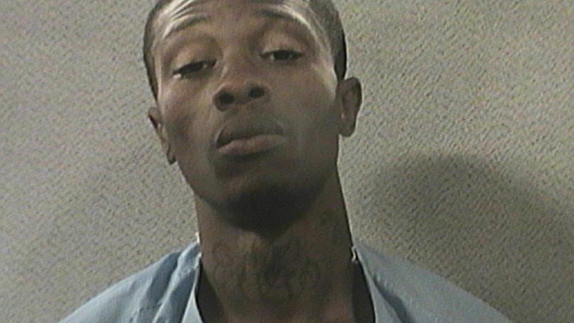 This photo provided by the Orleans Parish Sheriff's Office shows Travis Boys. After an intense 24-hour manhunt, New Orleans police Sunday, June 21, 2015, arrested Boys, a suspect in the fatal shooting of a police officer as he was being transported to jail. Boys was still wearing his broken handcuffs when a rookie officer and his trainer spotted him trying to board a city bus Sunday morning, said Police Superintendent Michael Harrison. (Orleans Parish Sheriff's Office via AP)