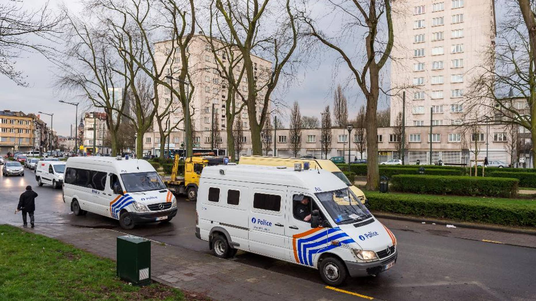 Police secure an area where two terror suspects were arrested in Brussels on Friday April 8, 2016. A fugitive suspect in the Nov. 13 Paris attacks was arrested in Belgium on Friday, French police officials said, after a raid Belgian authorities said was linked to the deadly March 22 Brussels bombings. The suspect, Mohamed Abrini, is believed to be the mysterious "man in the hat" who escaped the double bombing at the Zaventem airport, according to one of the French officials.(AP Photo/Geert Vanden Wijngaert)