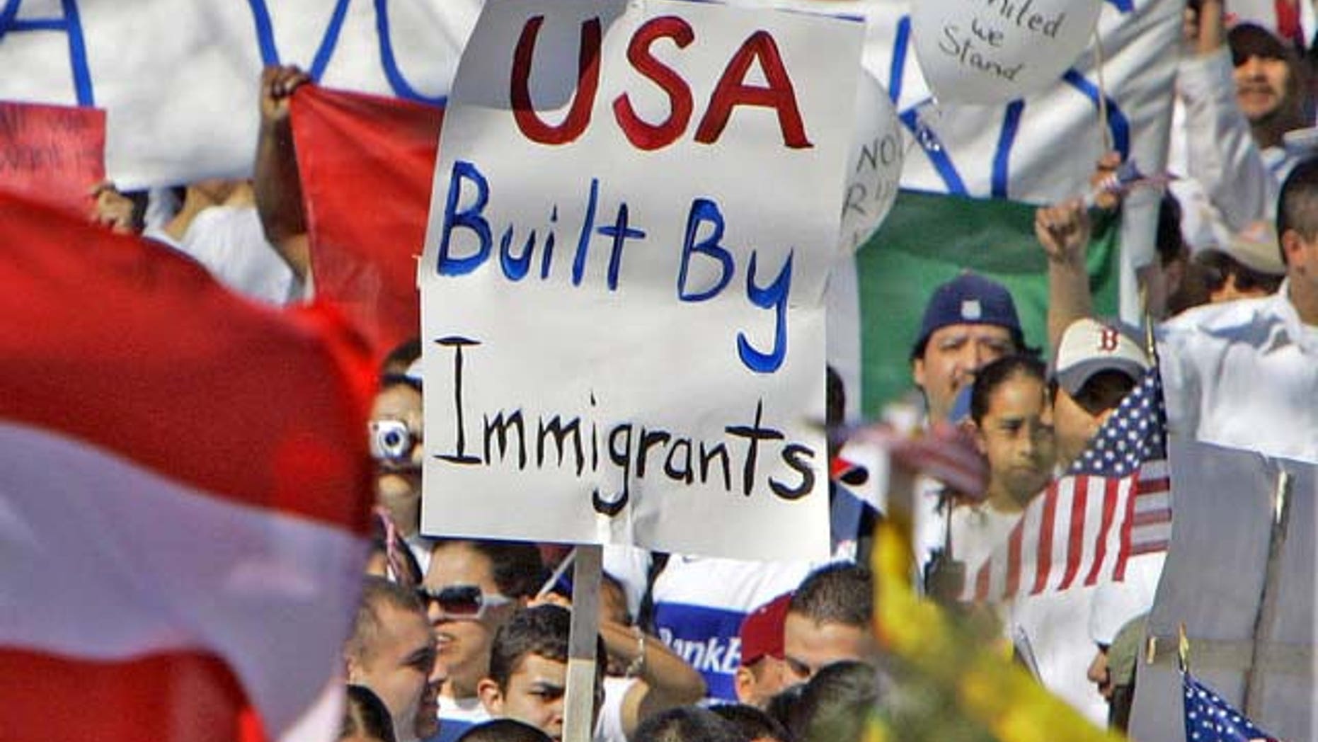 Some 4,000 people attend a rally outside the Capitol in Lincoln, Neb., Monday, April 10, 2006, where protesters carried flags from the United States, Mexico and other nations. Thousands of immigrants gathered at rallies across the state Monday as part of a national day of action billed as a "campaign for immigrants' dignity." (AP Photo/Nati Harnik)
