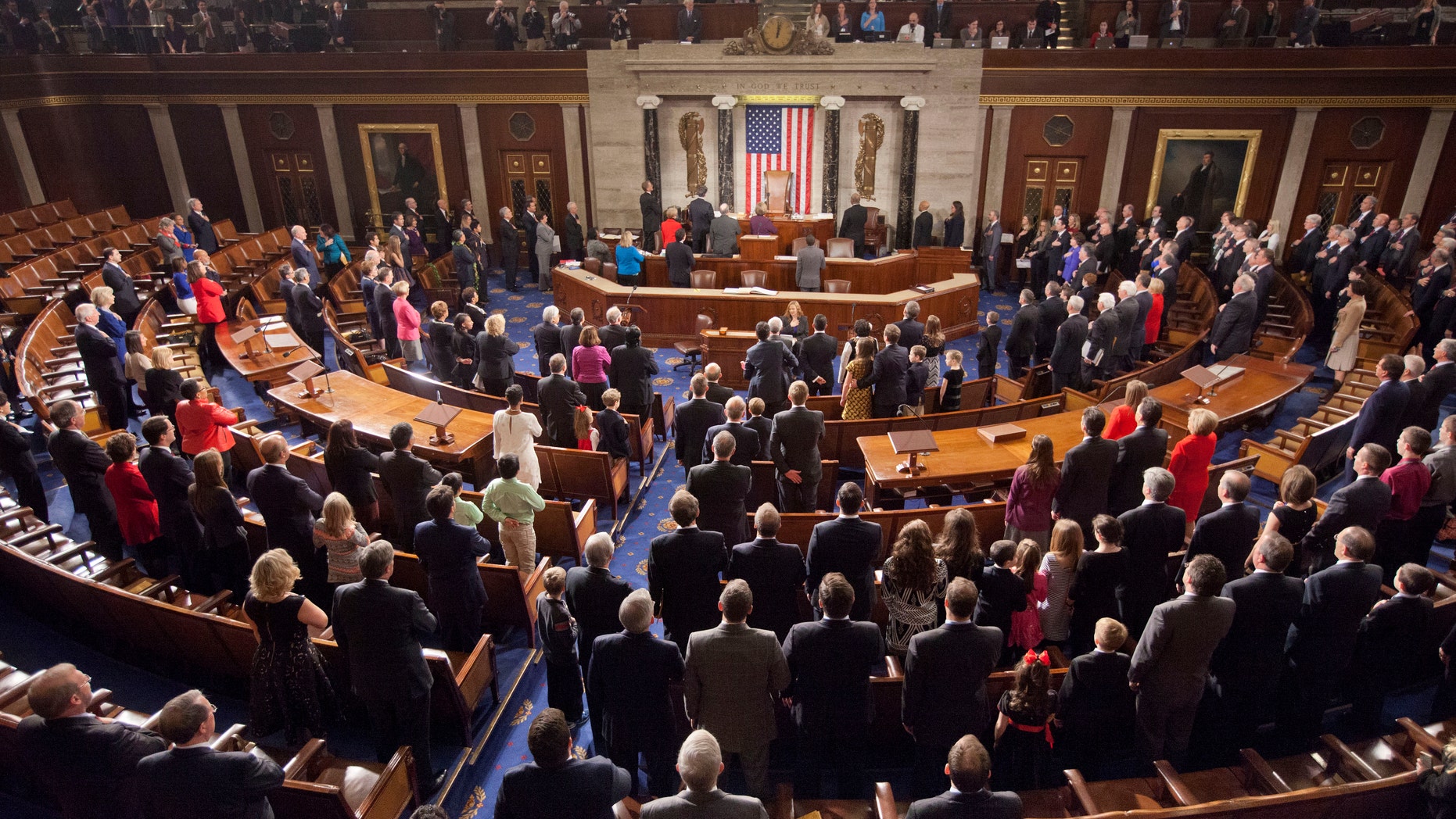 FILE -- Jan. 6, 2015: Members of the House of Representatives stand for the Pledge of Allegiance at the opening session of the 114th Congress, on Capitol Hill in Washington.