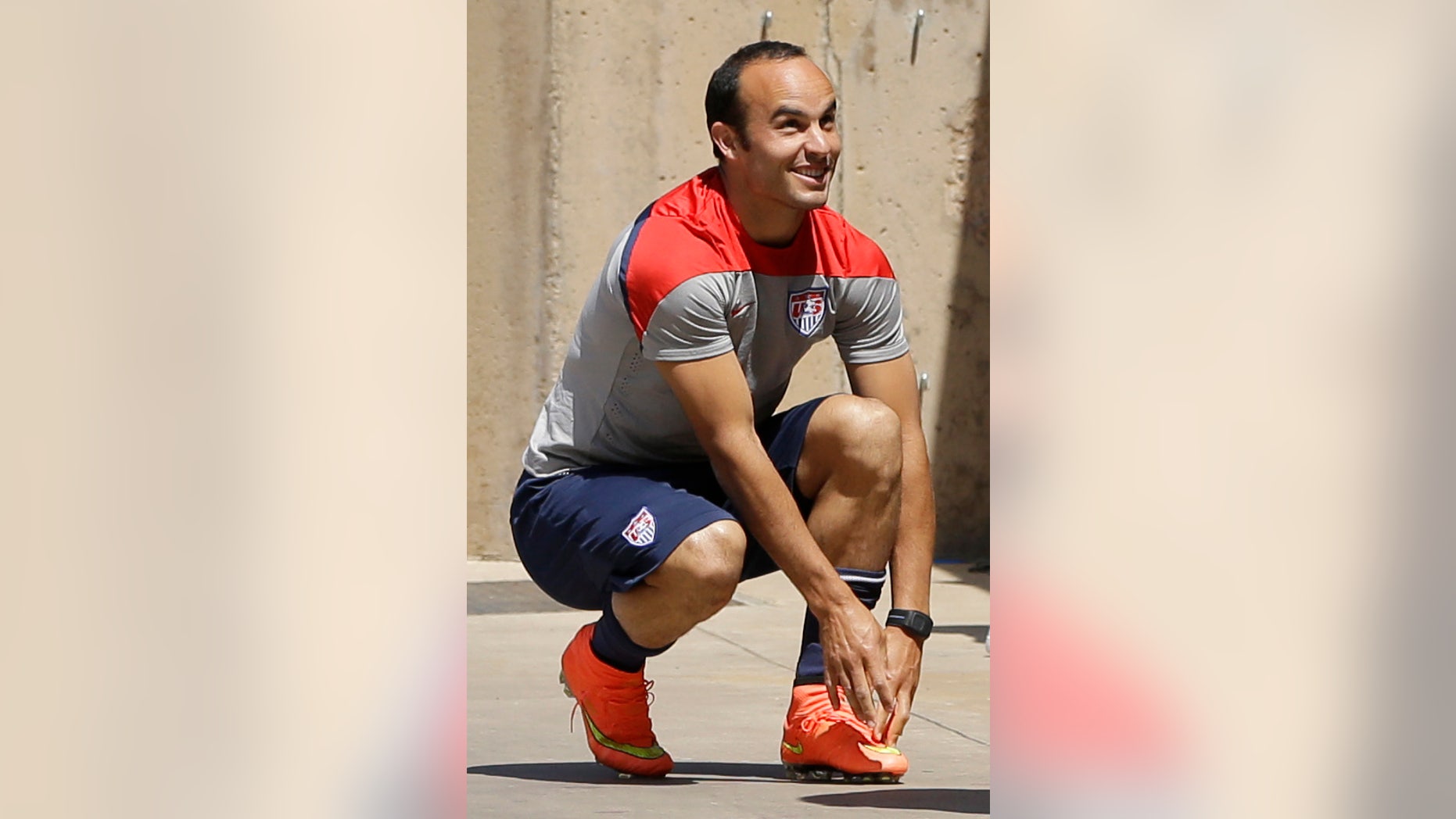 U.S. forward Landon Donovan stretches prior to practice for the World Cup soccer tournament Thursday, May 22, 2014, in Stanford, Calif. Donovan was cut from the roster later Thursday for the World Cup. (AP Photo/Ben Margot)