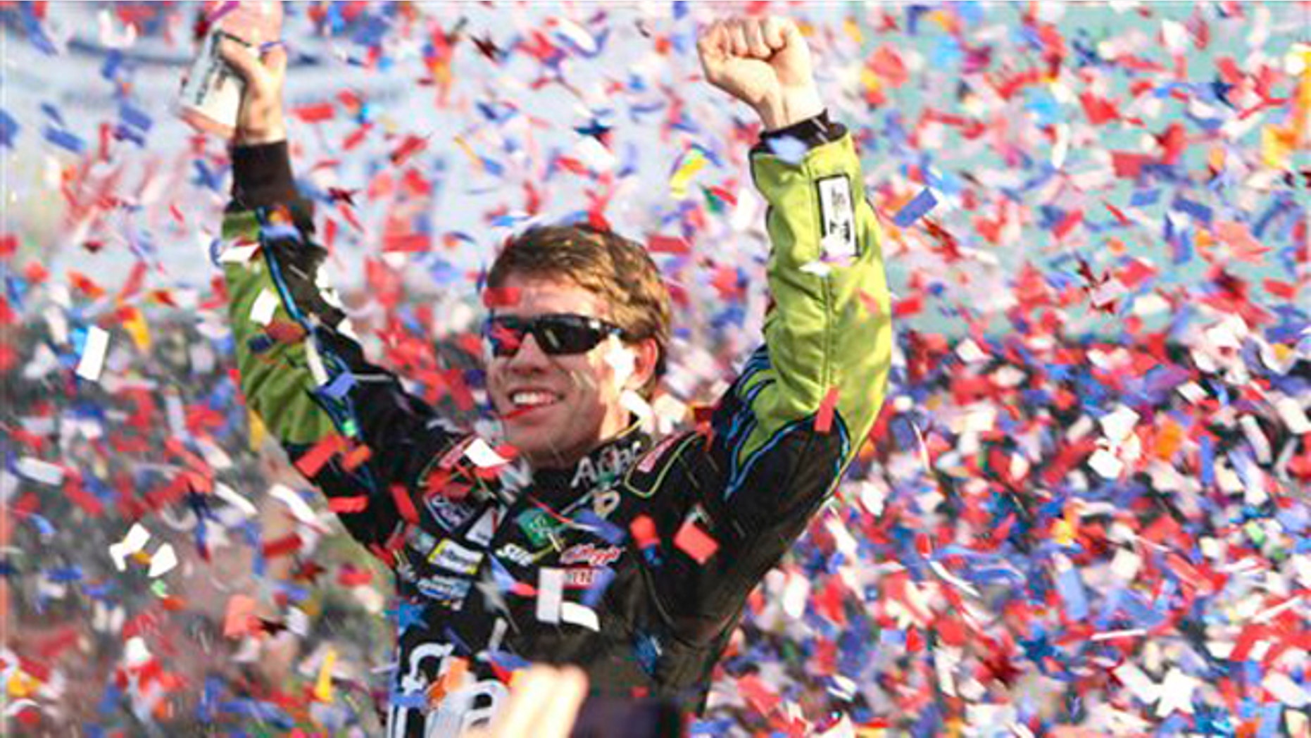 NASCAR driver Carl Edwards celebrates after winning the Ford 400 auto race Sunday, Nov. 21, 2010 in Homestead, Fla.
