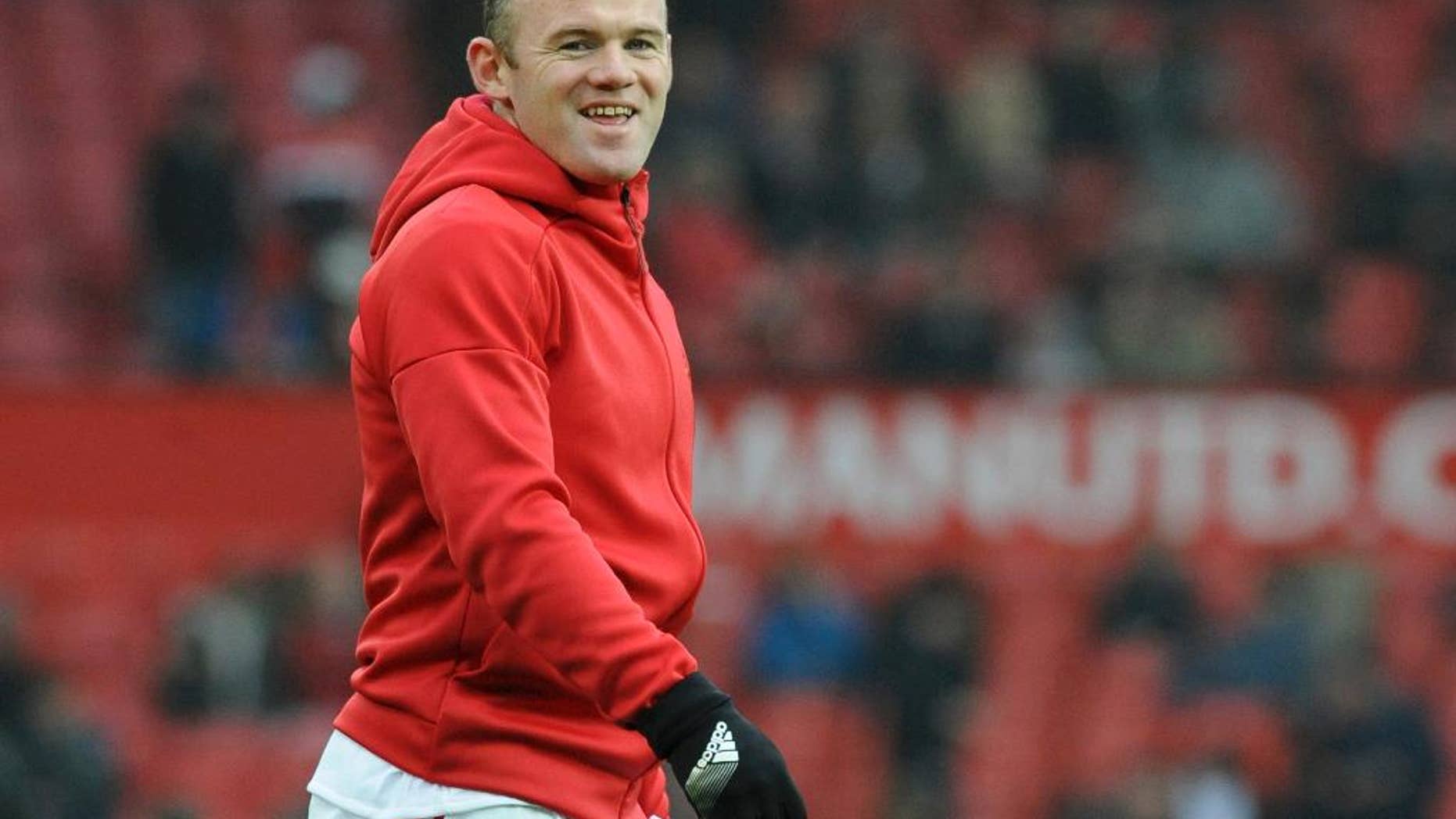Manchester United's Wayne Rooney warms up ahead of during the English FA Cup Third Round match between Manchester United and Reading at Old Trafford in Manchester, England, Saturday, Jan. 7, 2017. (AP Photo/Rui Vieira)