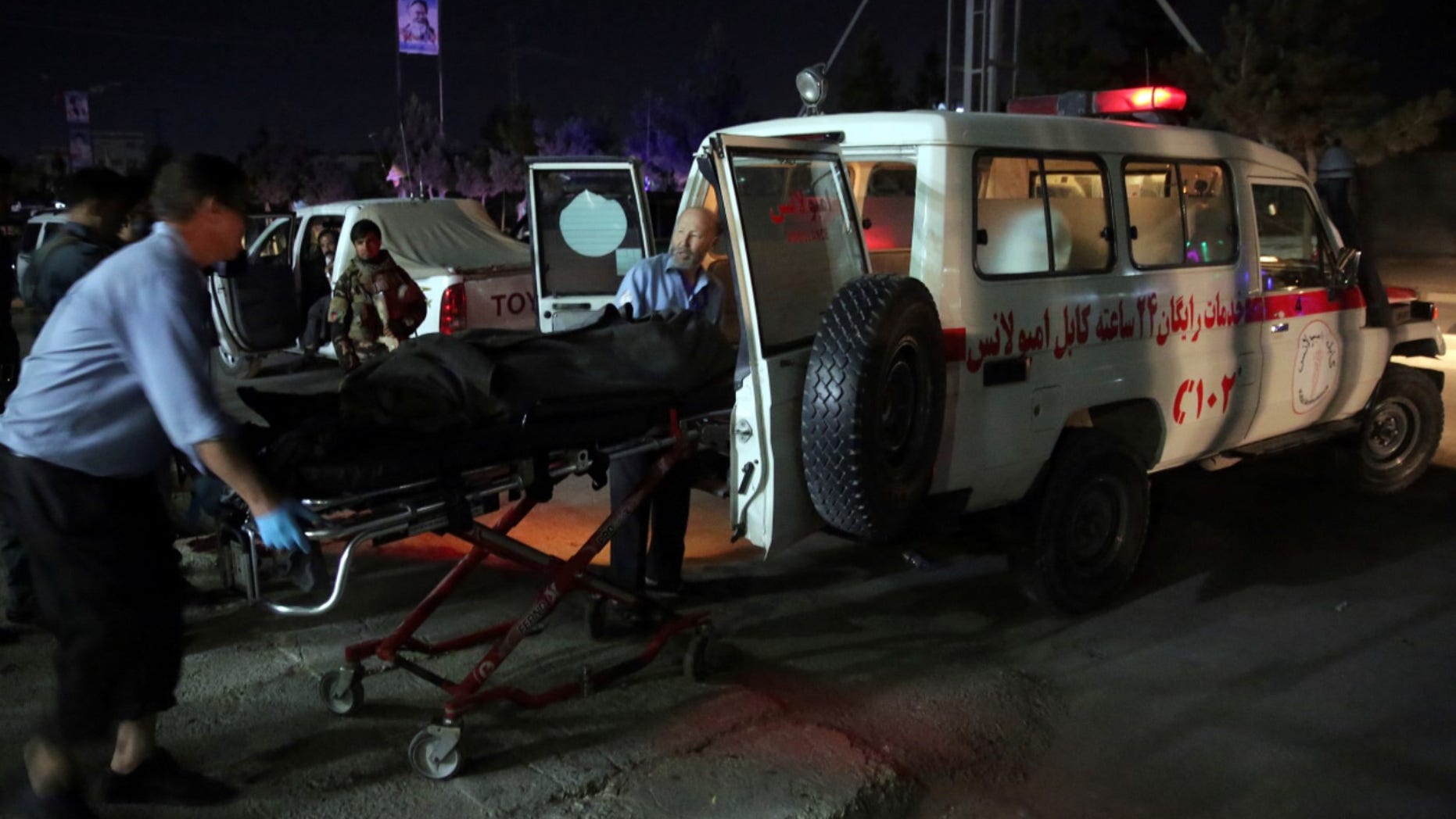 Medic personnel transport the body of a victim into an ambulance at the site of a suicide attack on a Shiites mosque in Kabul, Afghanistan, Thursday, June 15, 2017. A suicide bomber struck outside a Shiite mosque in the Afghan capital Kabul late Thursday night, killing a leader of Afghanistan's ethnic Hazaras, Hajji Ramazan Hussainzada, and others. (AP Photos/Massoud Hossaini)