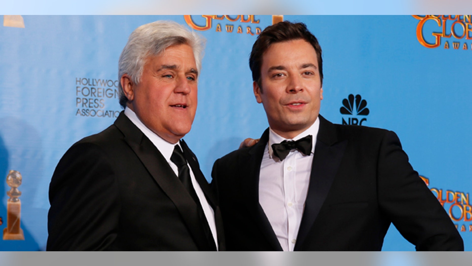 Late night talk show hosts Jay Leno (L) and Jimmy Fallon pose backstage at the 70th annual Golden Globe Awards in Beverly Hills, California, January 13, 2013.