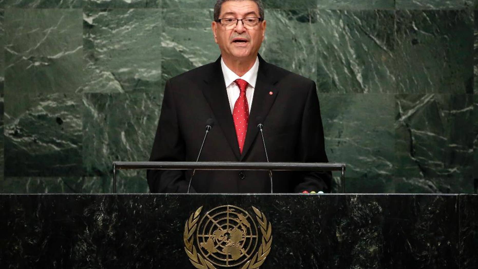 FILE- In this Sept. 27, 2015, file photo, Habib Essid, Head of Government of Tunisia, addresses the 2015 Sustainable Development Summit at United Nations headquarters. Tunisia's parliament passed a vote of no confidence in Prime Minister Habib Essid on Saturday, July 30, effectively disbanding the government of the U.S.-trained agricultural economist. (AP Photo/Richard Drew, File)