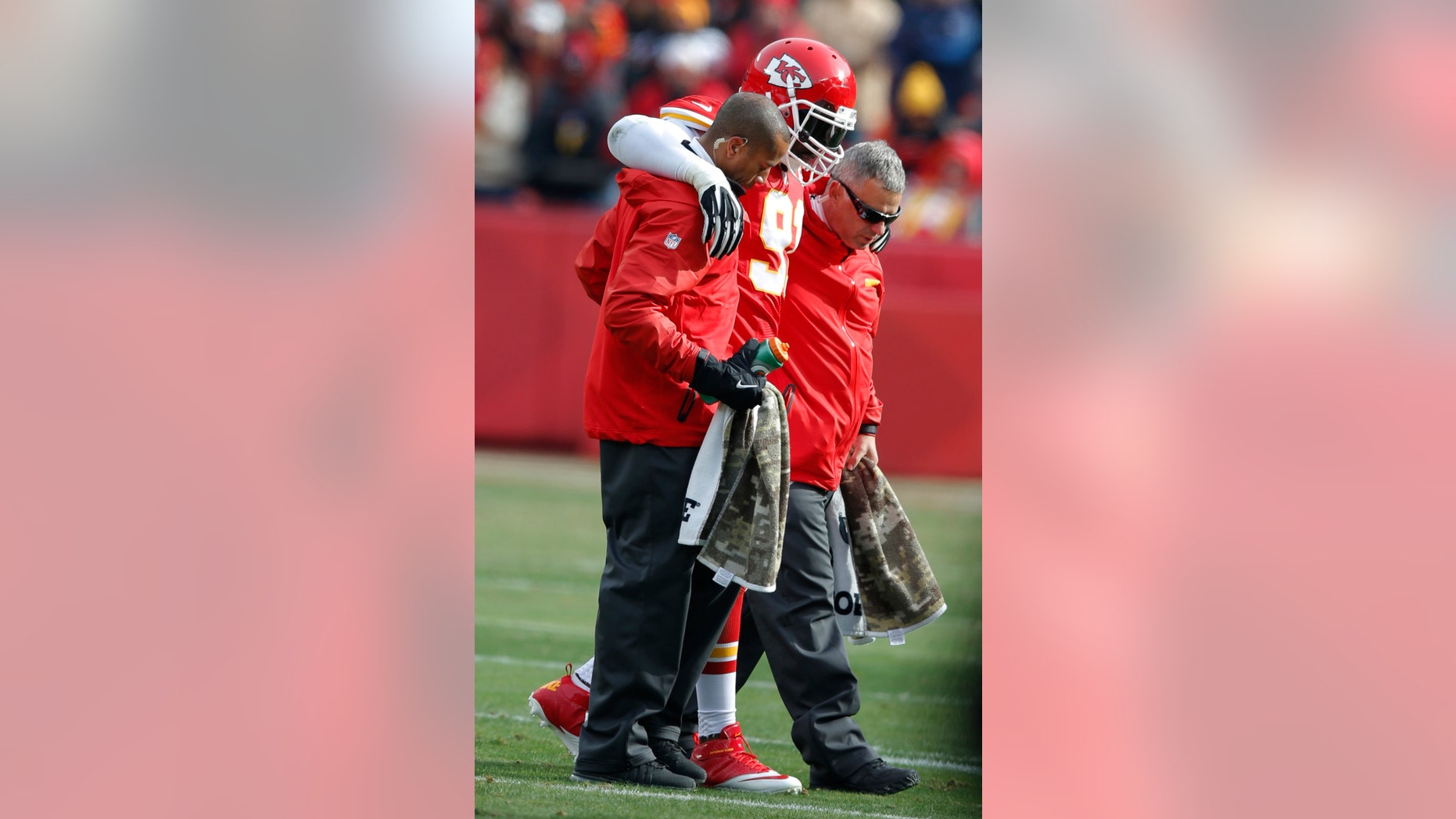 Kansas City Chiefs outside linebacker Tamba Hali (91) is helped from the field during the first half of an NFL football game against the San Diego Chargers in Kansas City, Mo., Sunday, Nov. 24, 2013. (AP Photo/Ed Zurga)
