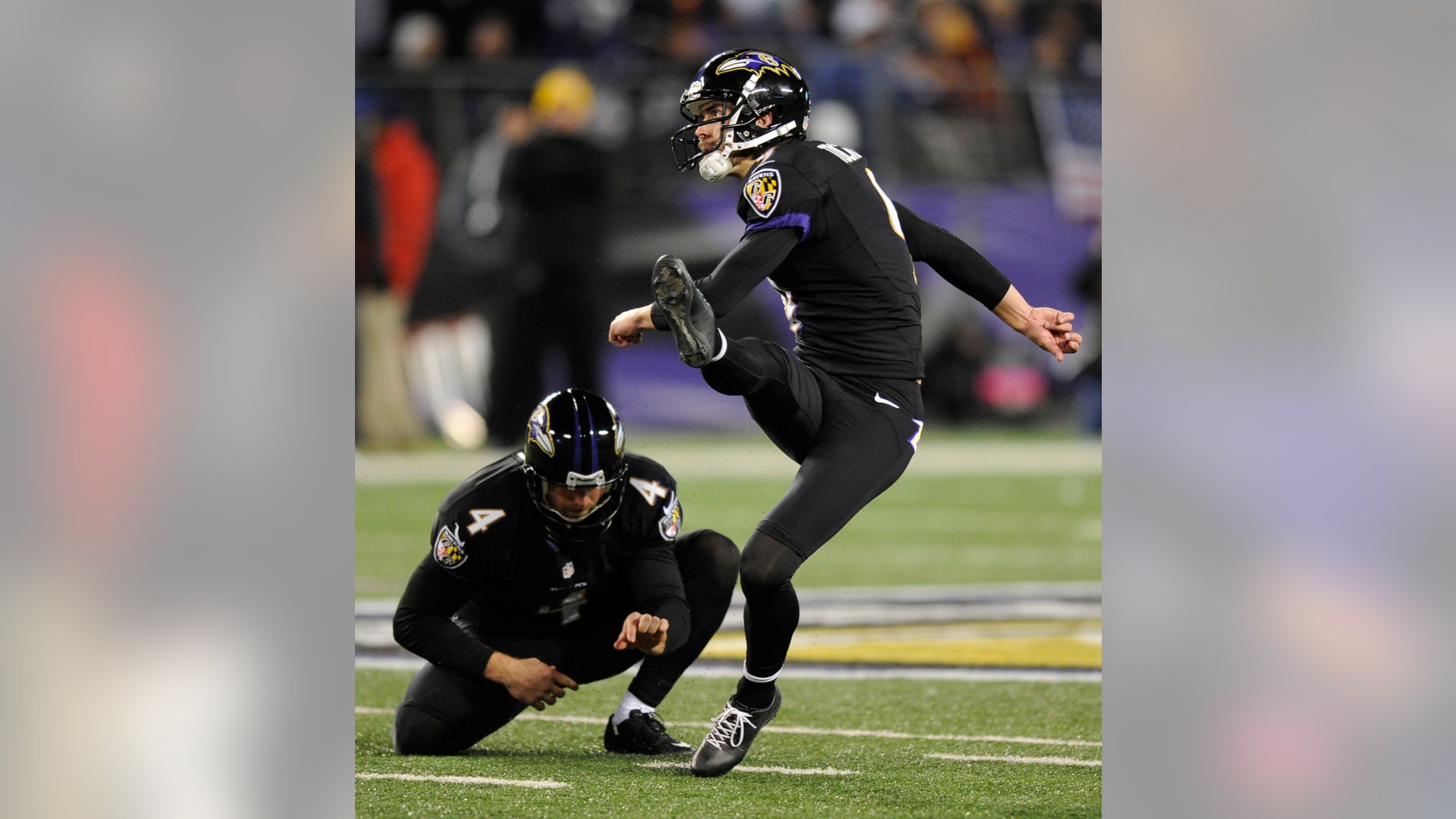 Baltimore Ravens' Justin Tucker (9) watches a successful field goal attempt alongside teammate Sam Koch in the second half of an NFL football game against the Pittsburgh Steelers, Thursday, Nov. 28, 2013, in Baltimore. Tucker contributed five field goals to Baltimore's 22-20 win. (AP Photo/Nick Wass)