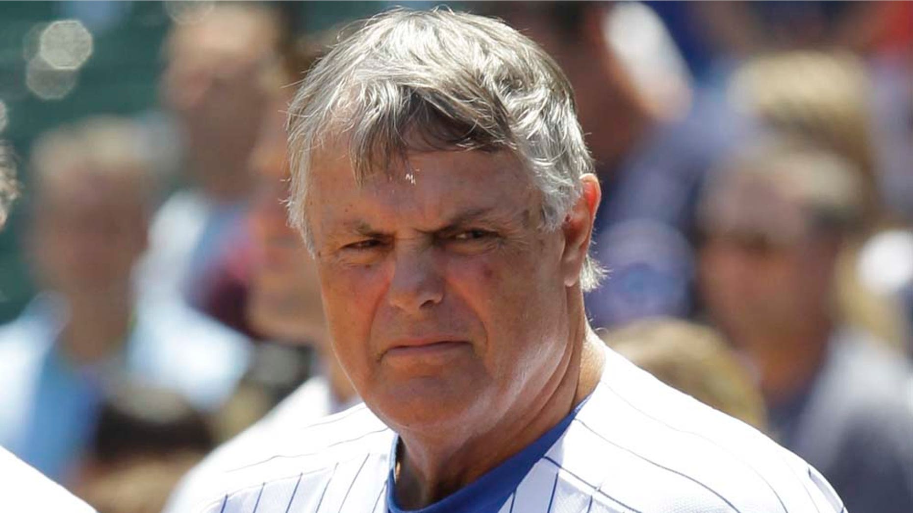 In this Thursday, June 17, 2010, file photo, Chicago Cubs manager Lou Piniella stands during the national anthem before an interleague baseball game against the Oakland Athletics at Wrigley Field in Chicago. The longtime skipper told The Associated Press on Wednesday, Feb. 2, 2011, he has agreed to a one-year contract with the San Francisco Giants to work as a special assistant for the World Series champions. Sweet Lou will report to general manager Brian Sabean. (AP Photo/Charles Rex Arbogast)