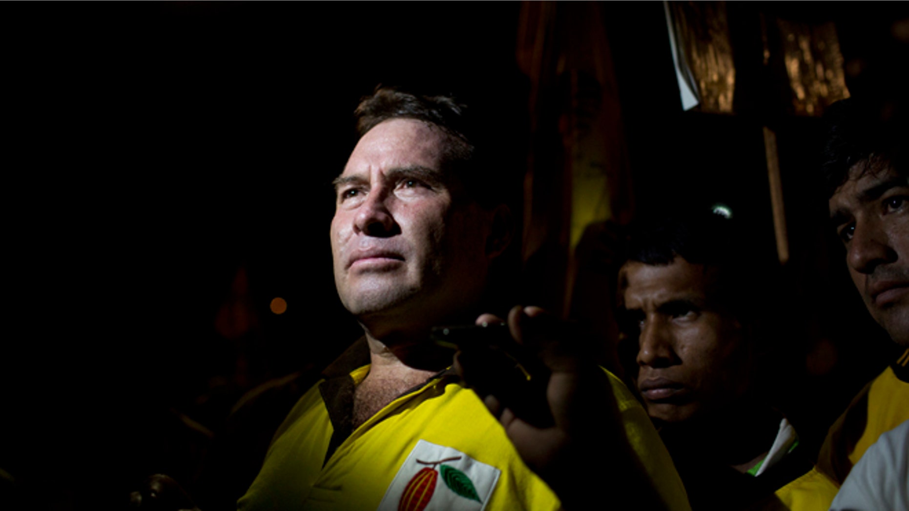 IIn this Sept. 25, 2014 photo, Ucayali gubernatorial candidate Manuel Gambini poses for a photo during an interview prior to a campaign rally in Irazola, Peru. As two-term mayor of Irazola, a poor farming district where the Andes meet the Amazon, Gambini enriched himself, relatives and associates closely tied to drug trafficking, according to an Aug. 29 order opening an investigation against them for money laundering. (AP Photo/Rodrigo Abd)