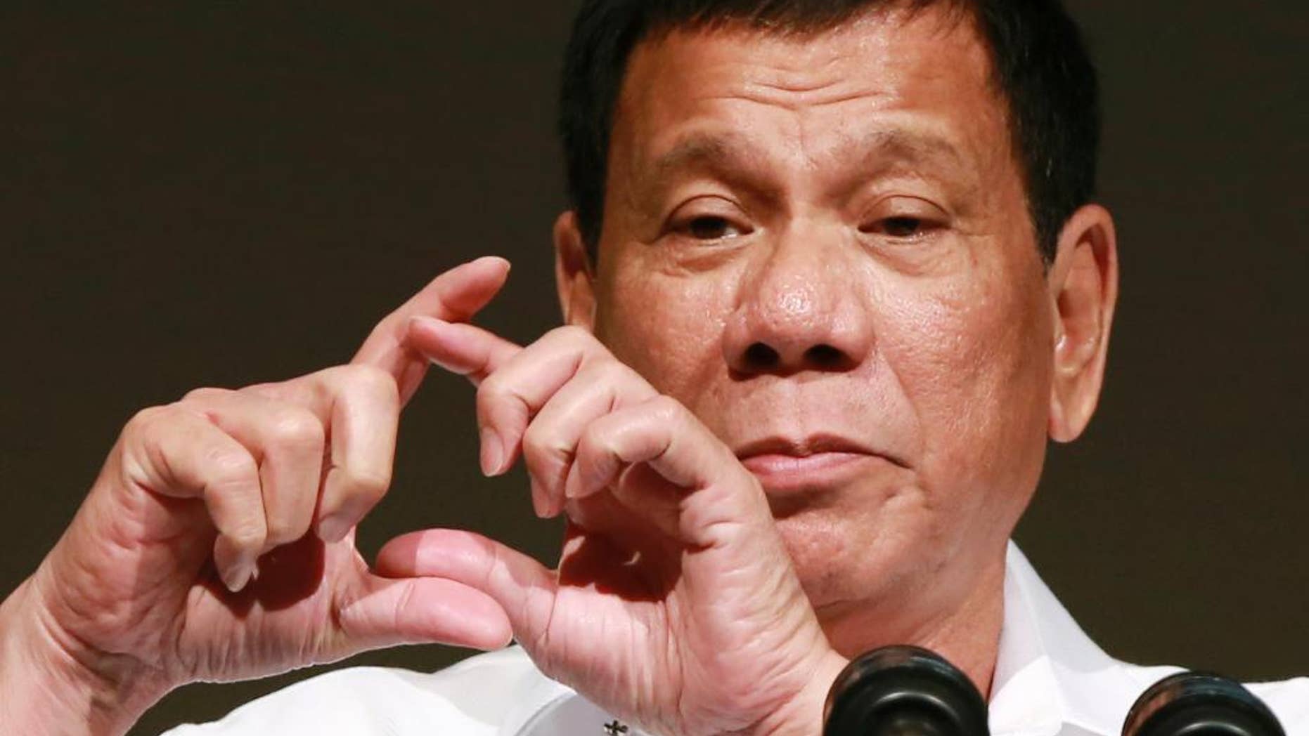 FILE - In this Oct. 26, 2016, file photo, Philippine President Rodrigo Duterte delivers a speech at the Philippine Economic Forum in Tokyo. Duterte, who has lashed out at U.S. President Barack Obama for criticizing his deadly crackdown on drugs, said his ties with the United States are likely to improve under Donald Trump, but that he is also excited to meet Russian leader Vladimir Putin at an upcoming Asia-Pacific summit. Duterte made upbeat remarks about both the president-elect and Putin at a news conference late Tuesday, Nov. 15, 2016 in Manila. (AP Photo/Eugene Hoshiko, File)