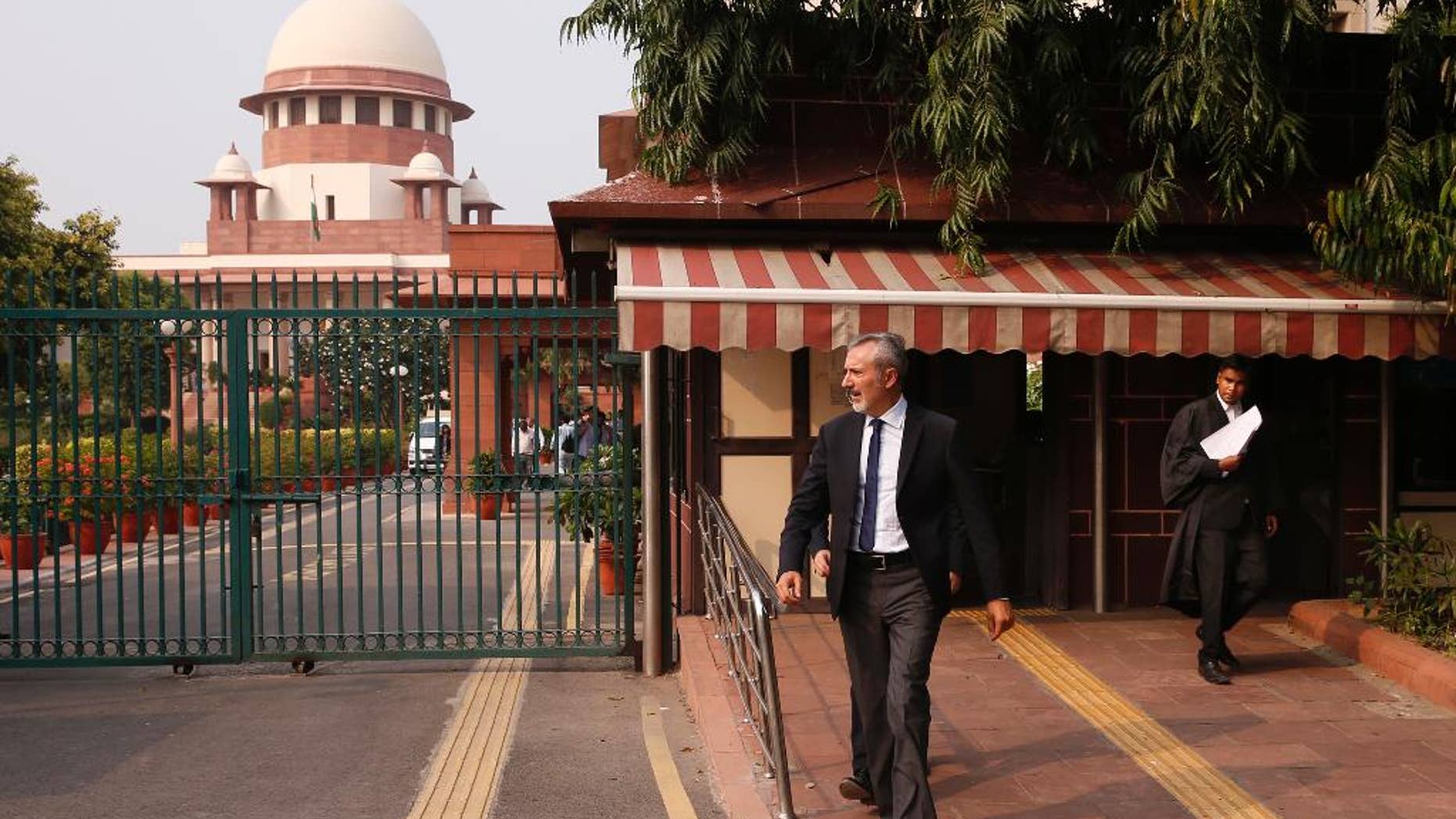 Italian ambassador to India Lorenzo Angeloni walks out of the Supreme Court in New Delhi, India, Tuesday, Sept. 20, 2016. The court was to decide on a plea to let Italian marine Massimiliano Latorre be allowed to remain in Italy till an international tribunal decides on the jurisdiction of the case. The court posted the matter for further hearing on Sept. 28. (AP Photo/Saurabh Das)