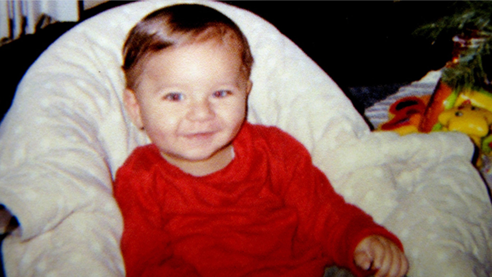 This photo provided by Sherry West on Friday, March 22, 2013 shows her son Antonio Santiago in his first Christmas in December 2012 in Brunswick, Ga.
