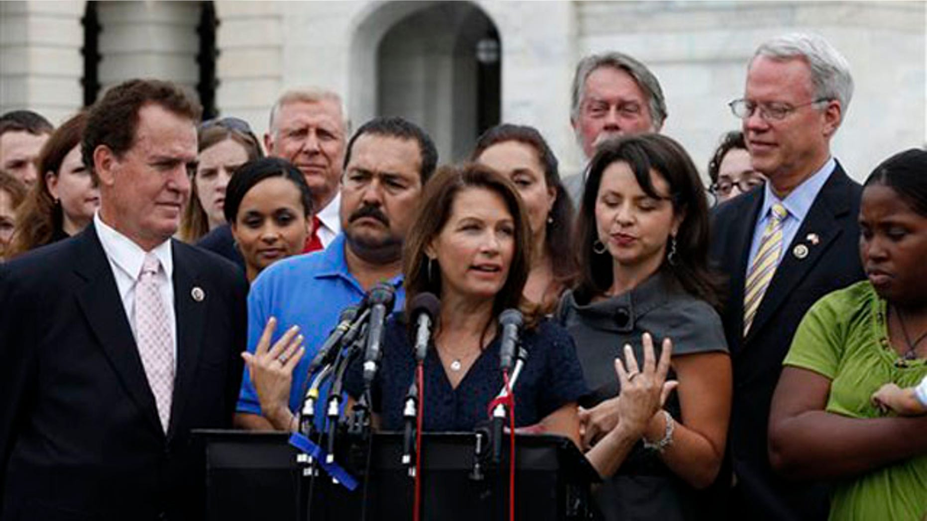 Rep. Michele Bachmann, center, speaks at a press conference for the Tea Party Caucus July 21 in Washington, D.C. (AP Photo)