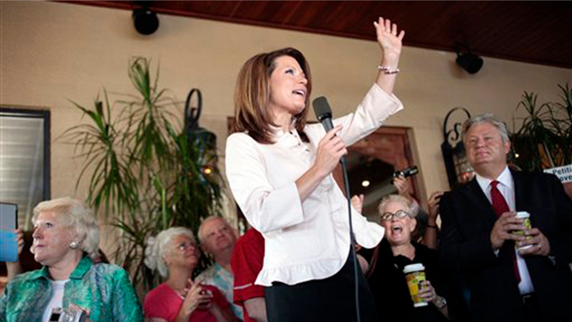 Rep. Michele Bachmann talks to a group of supporters on the porch of a bakery in Naples, Fla., on Aug. 29 during a campaign stop.