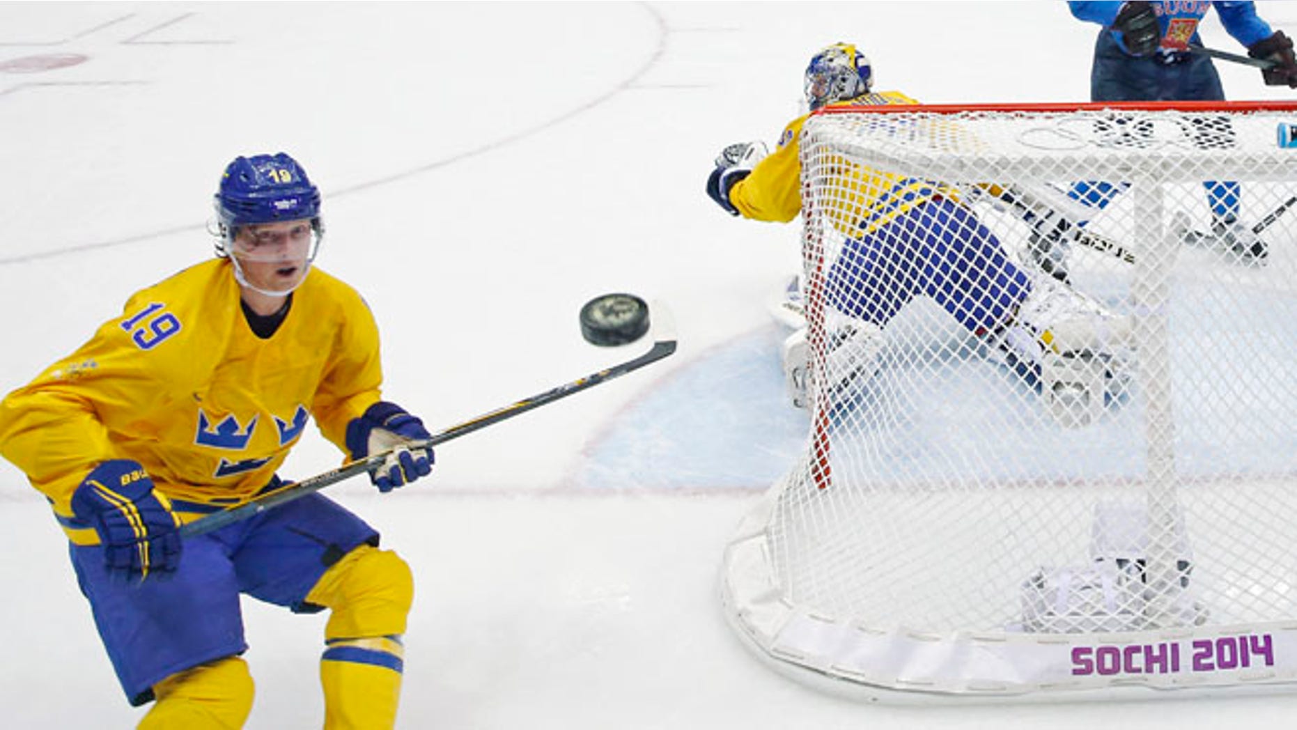 Feb. 21, 2014: Sweden forward Nicklas Backstrom watches a shot that got past Sweden goaltender Henrik Lundqvist during a men's semifinal ice hockey game against Finland at the 2014 Winter Olympics in Sochi, Russia.