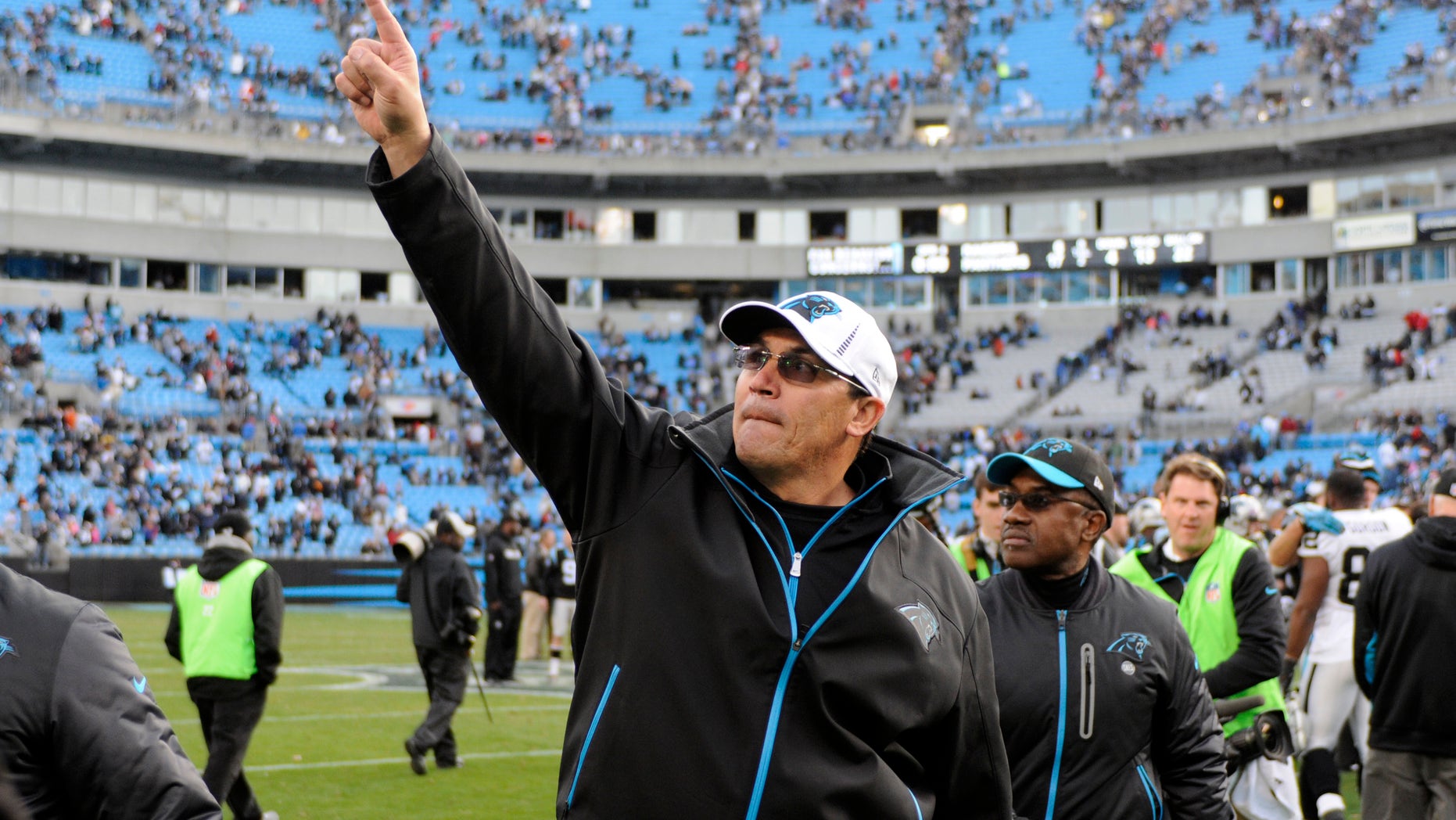 Carolina Panthers coach Ron Rivera acknowledges fans as he walks off the field after the Panthers defeated the Oakland Raiders 17-6 in an NFL football game in Charlotte, N.C., Sunday, Dec. 23, 2012. (AP Photo/Mike McCarn)