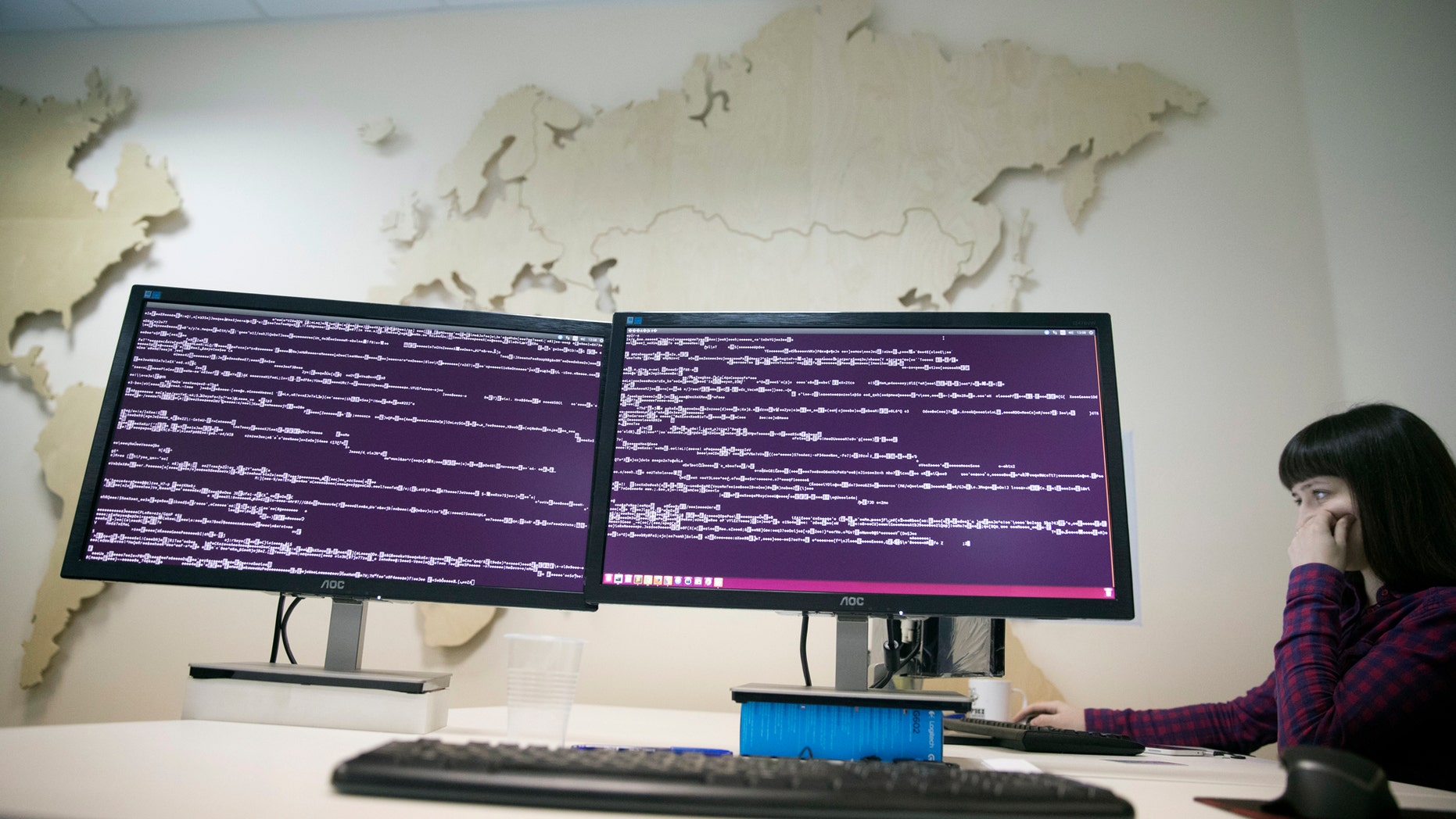 A computer code is seen on displays in the office of Global Cyber Security Company Group-IB in Moscow, Russia, Wednesday, Oct. 25, 2017 as reports emerge of new ransomware dubbed 'Bad Rabbit.' (AP Photo/Pavel Golovkin)