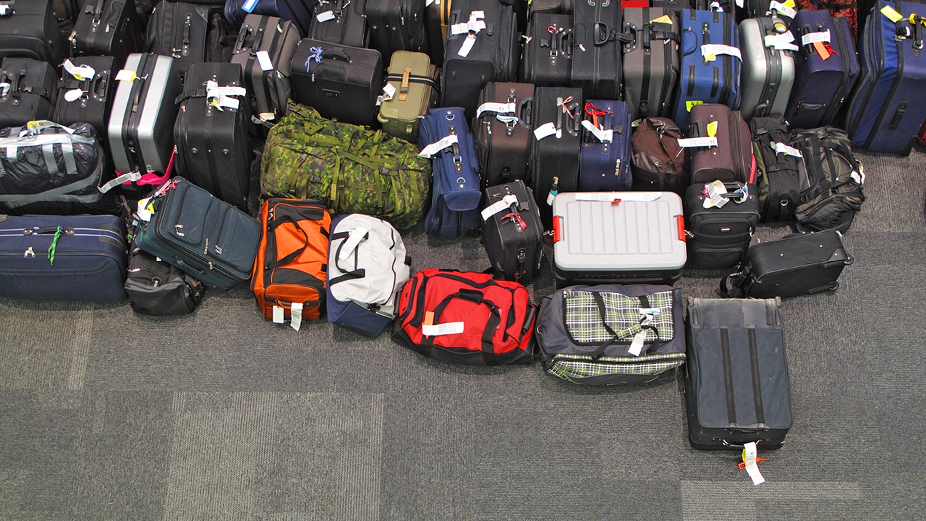 A clogged toilet was reportedly the cause of the backup that overflowed into the baggage area.