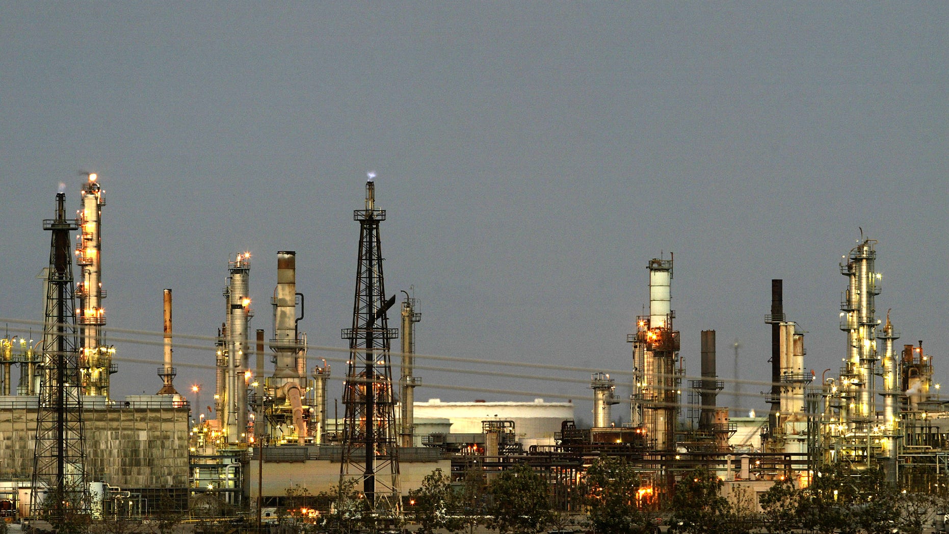 BAKERSFIELD, CA - AUGUST 14: The Shell Bakersfield Refinery in the town of Oildale on August 14, 2004 near Bakersfield, California. The refinery will continue to operate past its planned October 1 shutdown as part of an accord between Shell and state Attorney General Bill Lockyer who has been pressuring Shell to keep the plant open or find a buyer. The move to keep the plant running until December 31 or beyond is being called a temporary victory for California motorists as closing the 70,000 barrel a day refinery could escalate already-high gasoline prices. Shell, the U.S. unit of Royal Dutch/Shell Group, says local supplies of crude oil have declined. California's Central Valley is one of the nation's most important agricultural and oil producing areas. (Photo by David McNew/Getty Images)