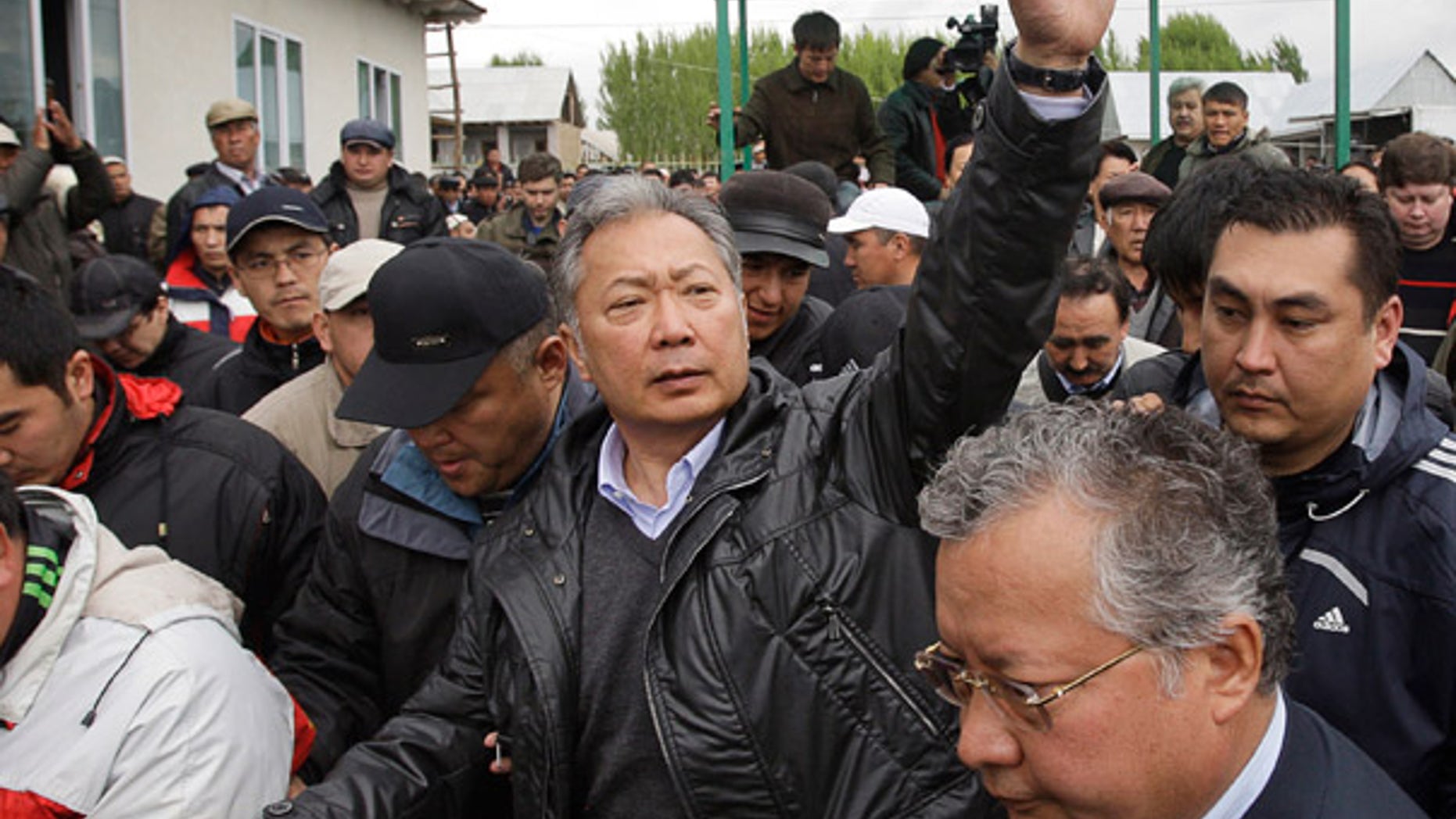 April 12: Kyrgyzstan's deposed President Kurmanbek Bakiyev greets supporters after a rally in the village of Teyit.