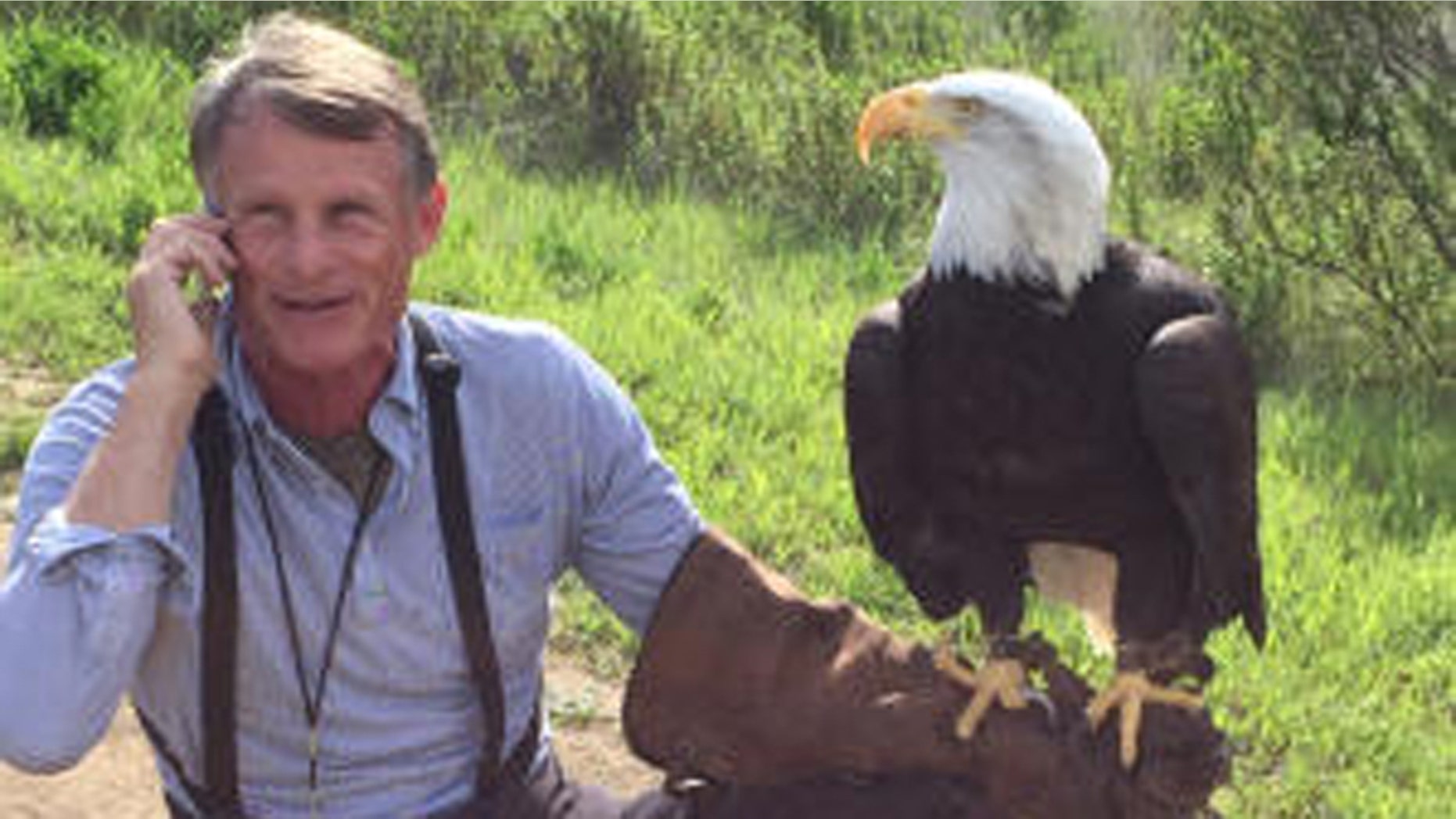 Photo shows Sequoia bald eagle and Palo Alto Junior Museum and Zoo director John Aikin. (Palo Alto Junior Museum & Zoo)