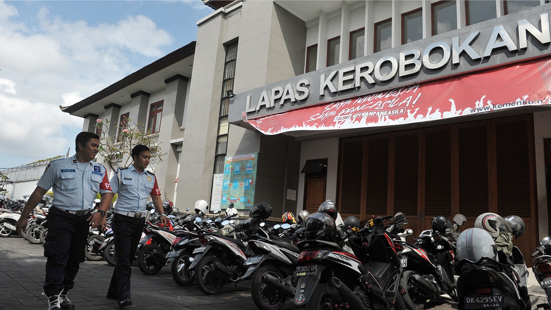 Security personnel walk in front of Kerobokan prison in Denpasar, Bali, Indonesia, June 19, 2017.