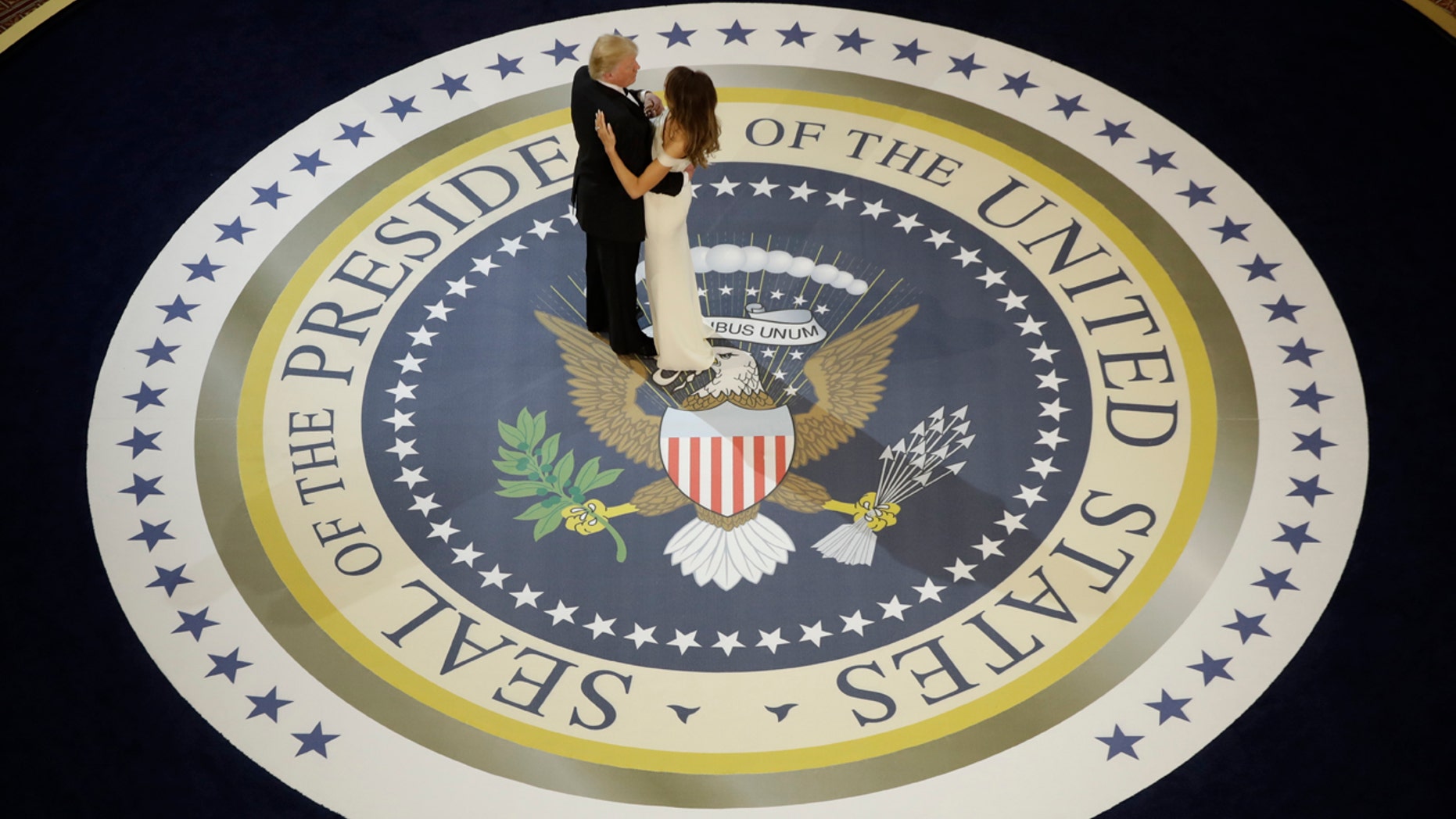 In this Jan. 20, 2017, file photo, President Donald Trump dances with first lady Melania Trump, at The Salute To Our Armed Services Inaugural Ball in Washington.