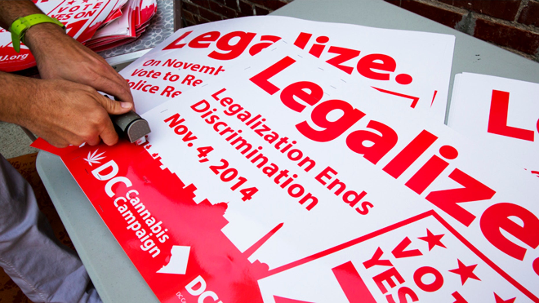 FILE: Oct. 9, 2014: DC Cannabis Campaign posters in support of legalizing small amounts of marijuana for personal use, Washington, D.C.