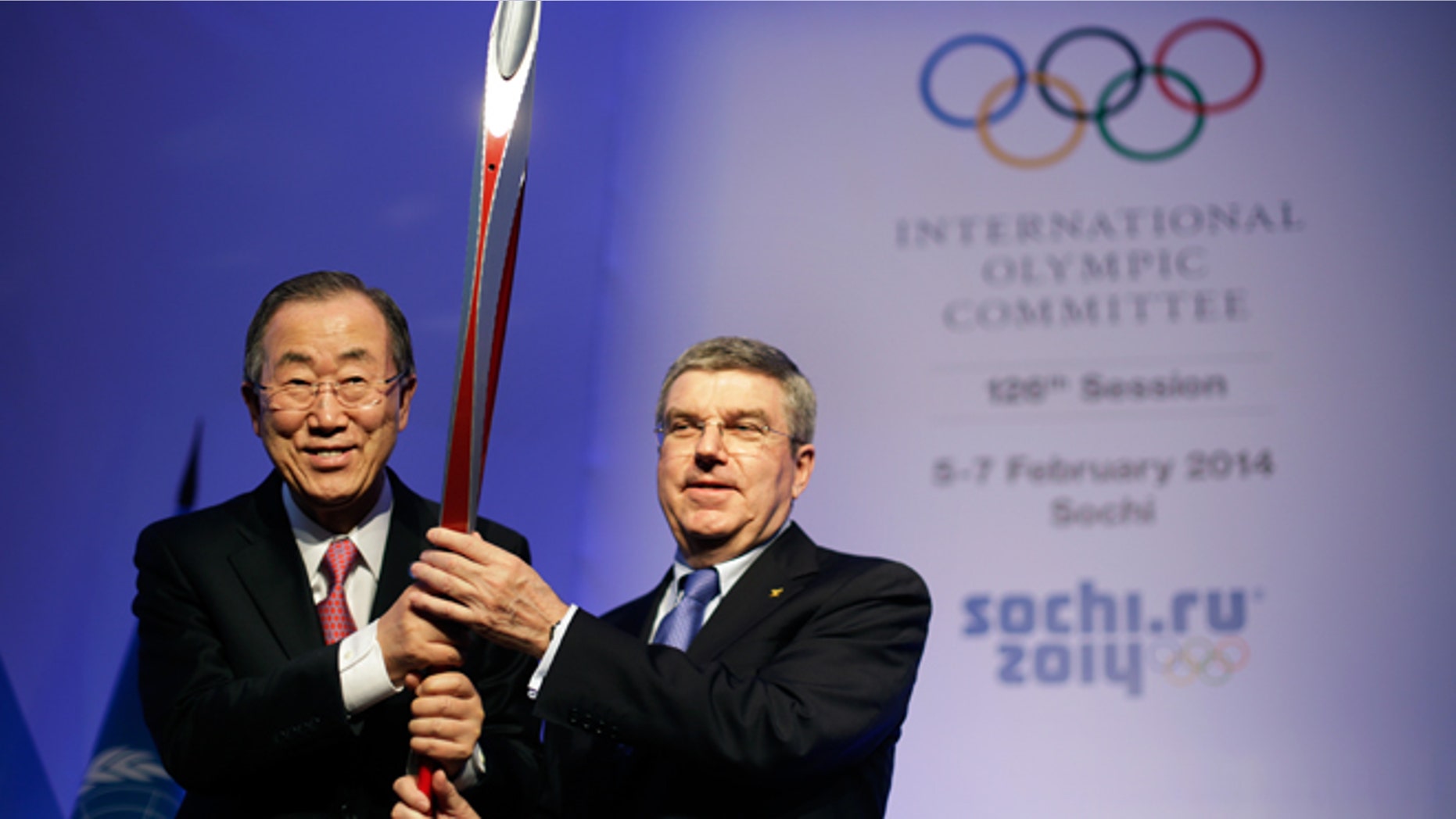 Feb. 6, 2014: United Nations Secretary-General Ban Ki-moon, left, is presented with an Olympic torch by International Olympic Committee President Thomas Bach, right, after Ban addressed the IOC's general assembly ahead of the upcoming 2014 Winter Olympics in Sochi, Russia.