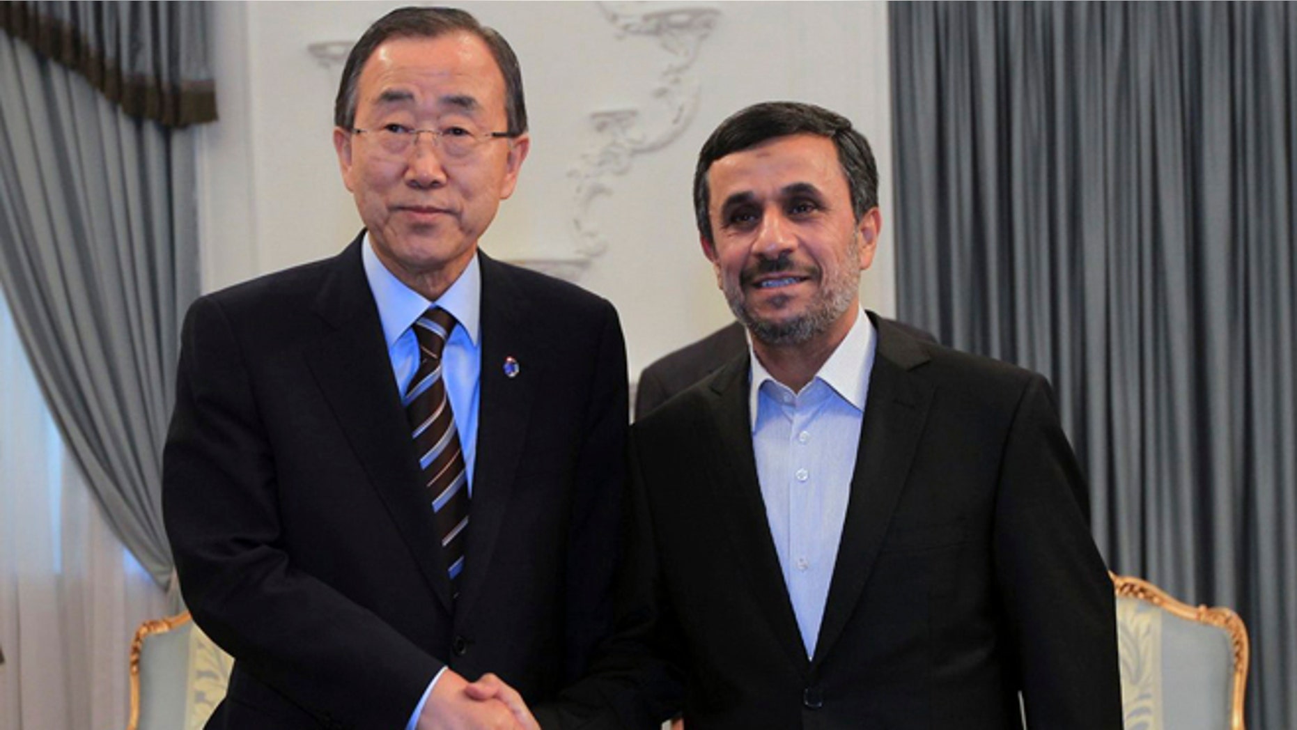 August 29, 2012: In this photo released by the official website of the Iranian Presidency Office, Iranian President Mahmoud Ahmadinejad, right, shakes hands with U.N. Secretary-General Ban Ki-Moon, at the start of their meeting in Tehran, Iran, Wednesday.