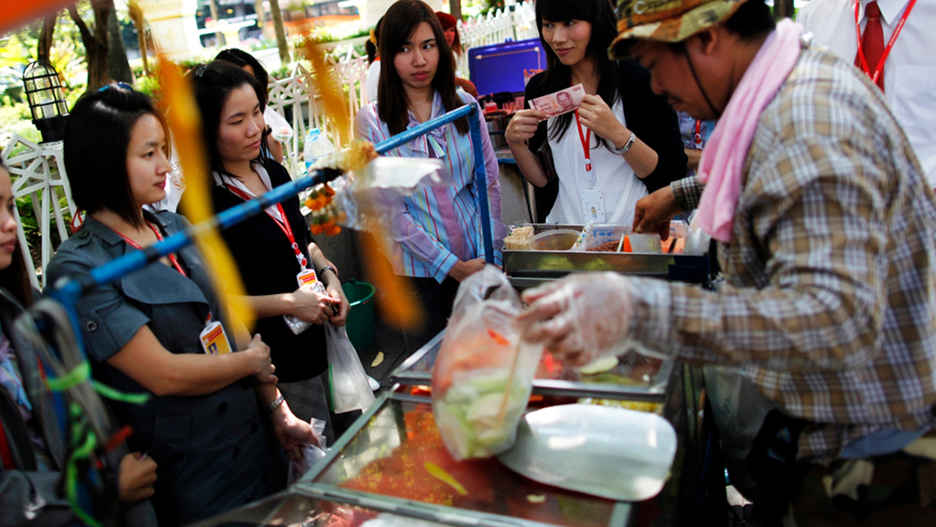 Street vendors hawk their wares in Bangkok, Thailand.
