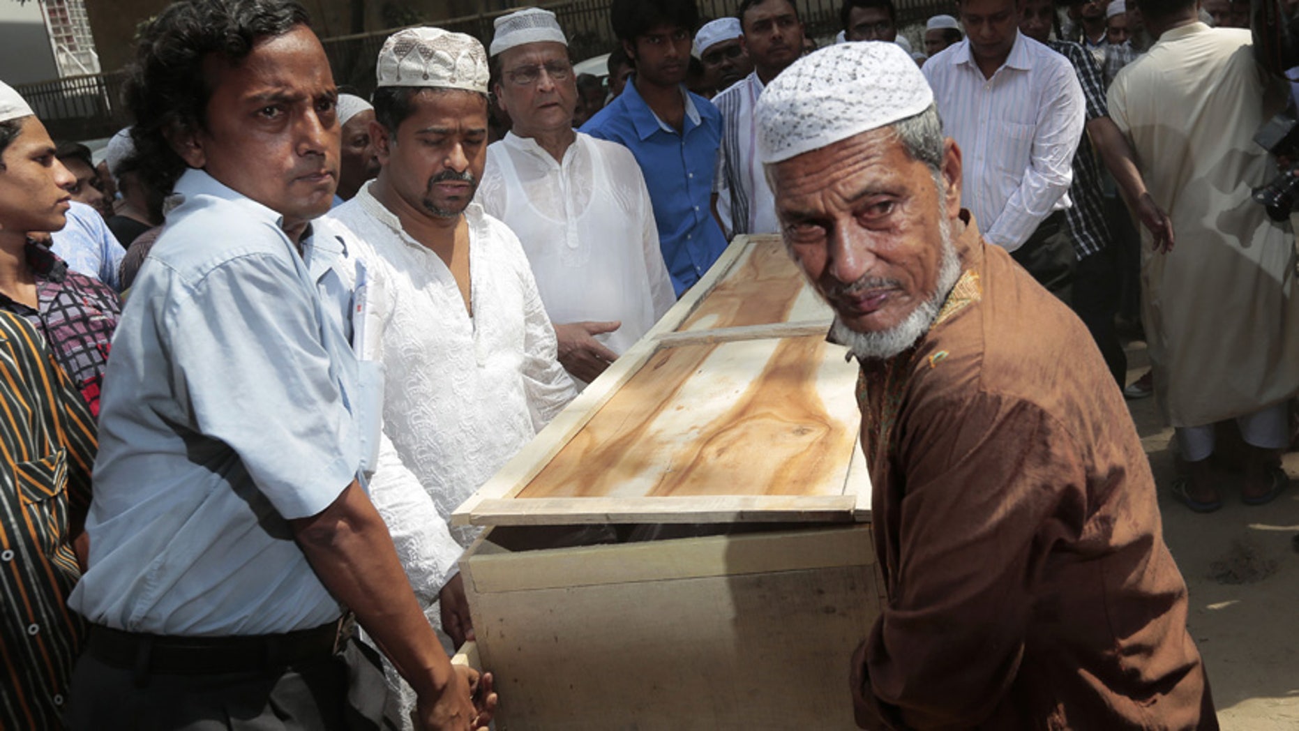 April 26, 2016: Bangladeshi Muslims carry the body of Xulhaz Mannan who was stabbed to death by unidentified assailants for his funeral in Dhaka, Bangladesh.