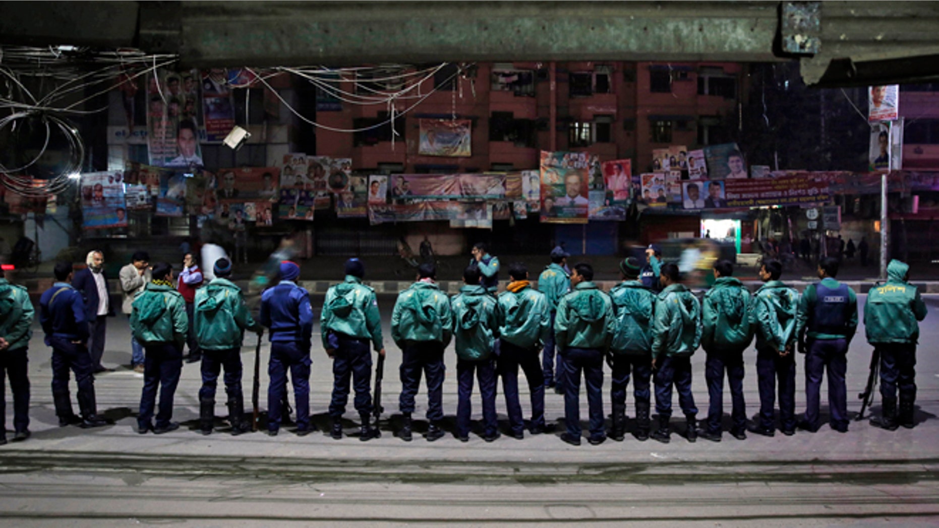 Jan. 4, 2013: Bangladeshi policemen stand guard outside the office of the main opposition Bangladesh Nationalist Party (BNP) during a nationwide 48-hour strike called by them a day ahead of general elections in Dhaka, Bangladesh.