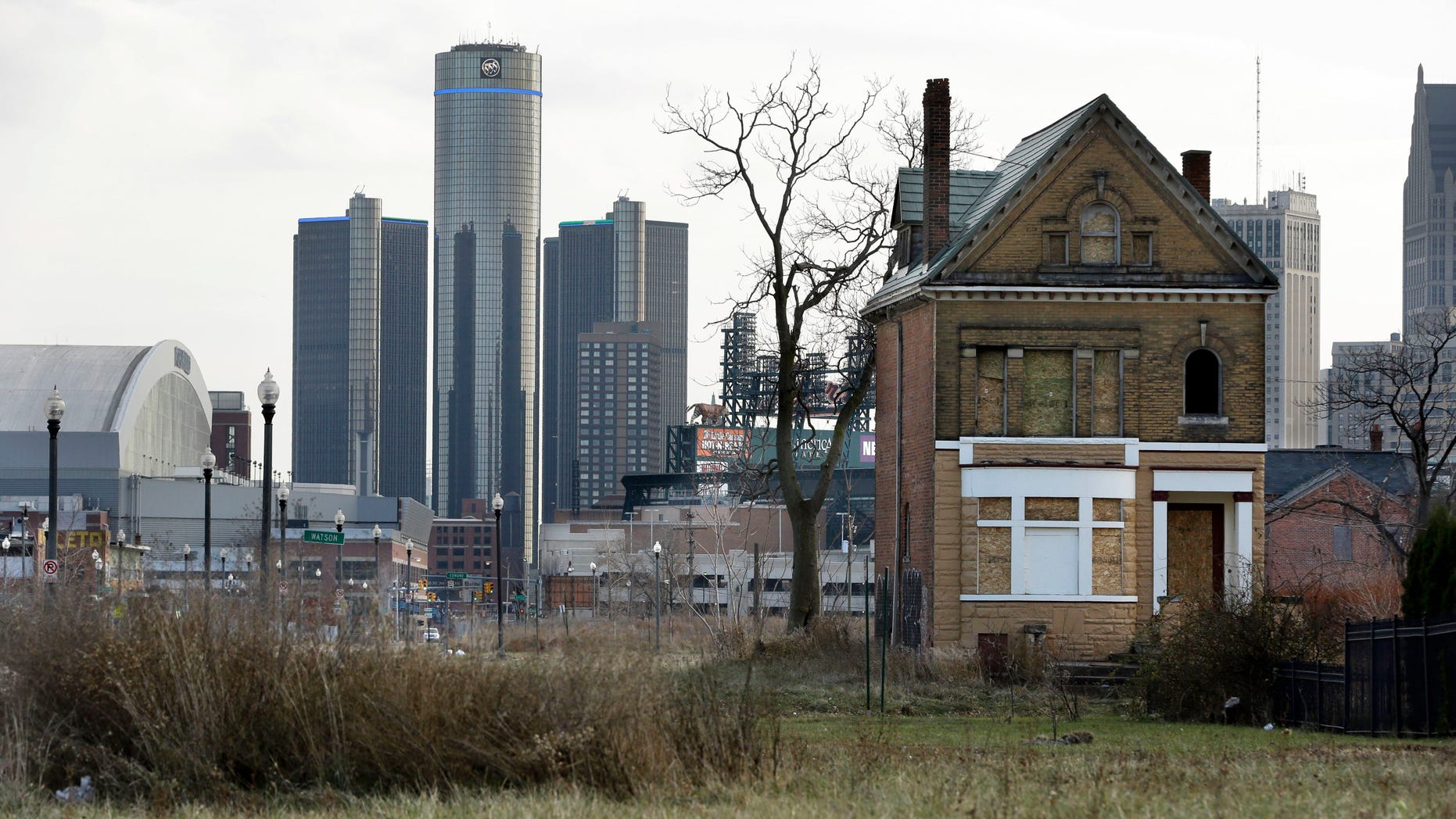 Dec. 2, 2013: An empty field in Brush Park, north of Detroit's downtown is shown with an abandoned home.