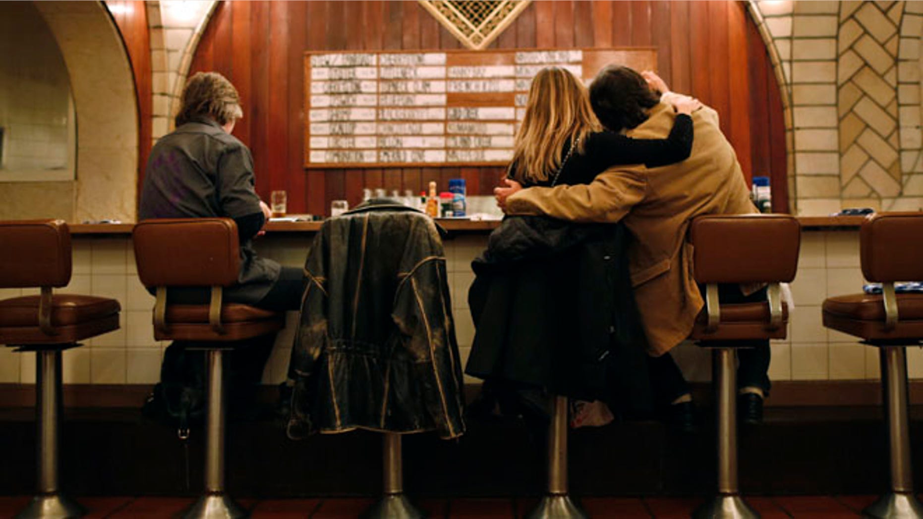 Customers sit at the counter of the Oyster bar in the lower level of Grand Central Terminal in New York, January 29, 2013.